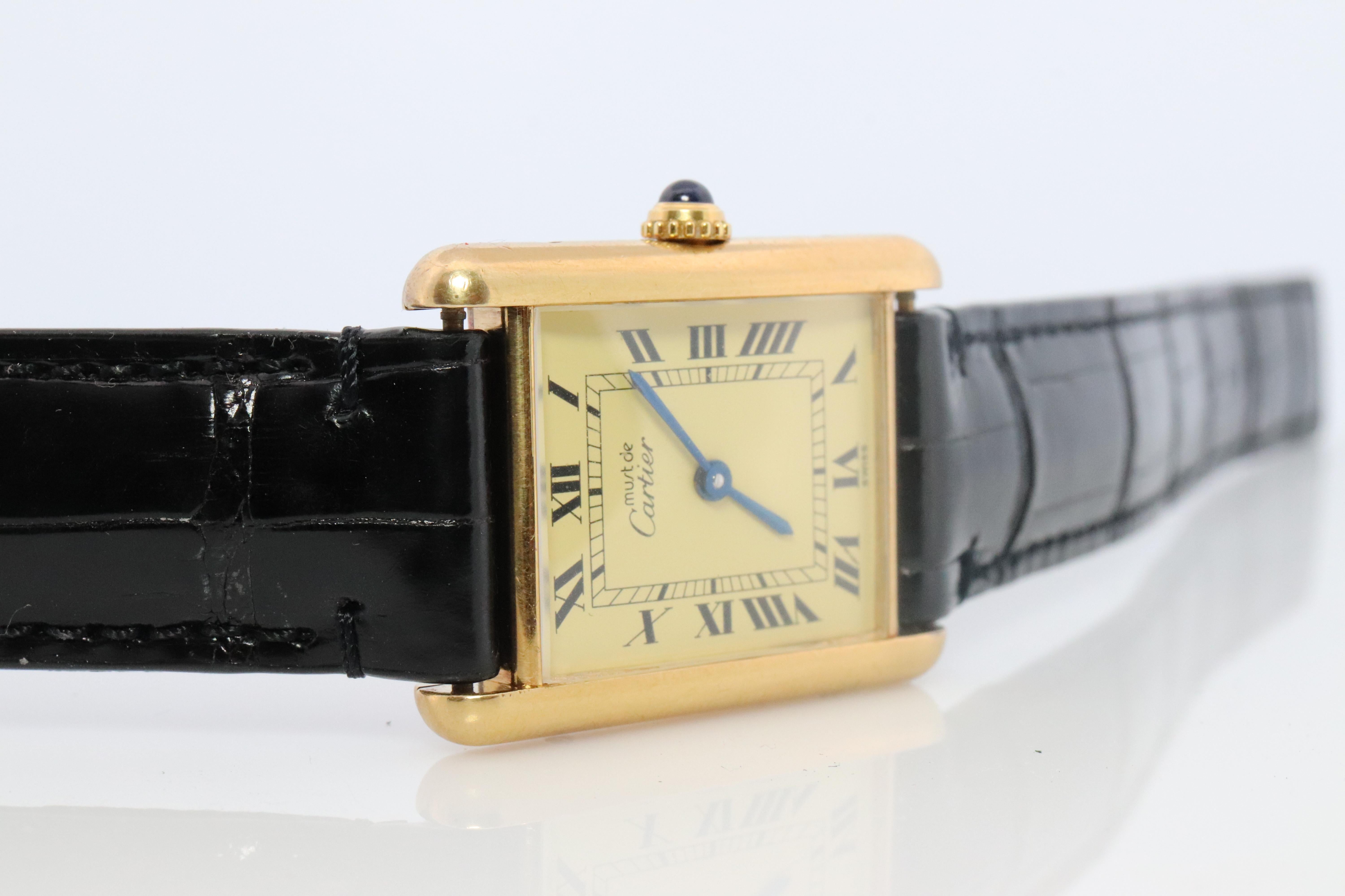 Genuine Cartier watch. Vintage Iconic Tank Argent. Sterling Silver and Gold plated (Vermeil).

Comes with a new GUCCI leather band

Champagne Dial with Quartz movement .

ref. 590005

Condition: Has some discoloration on the sides that is consistent