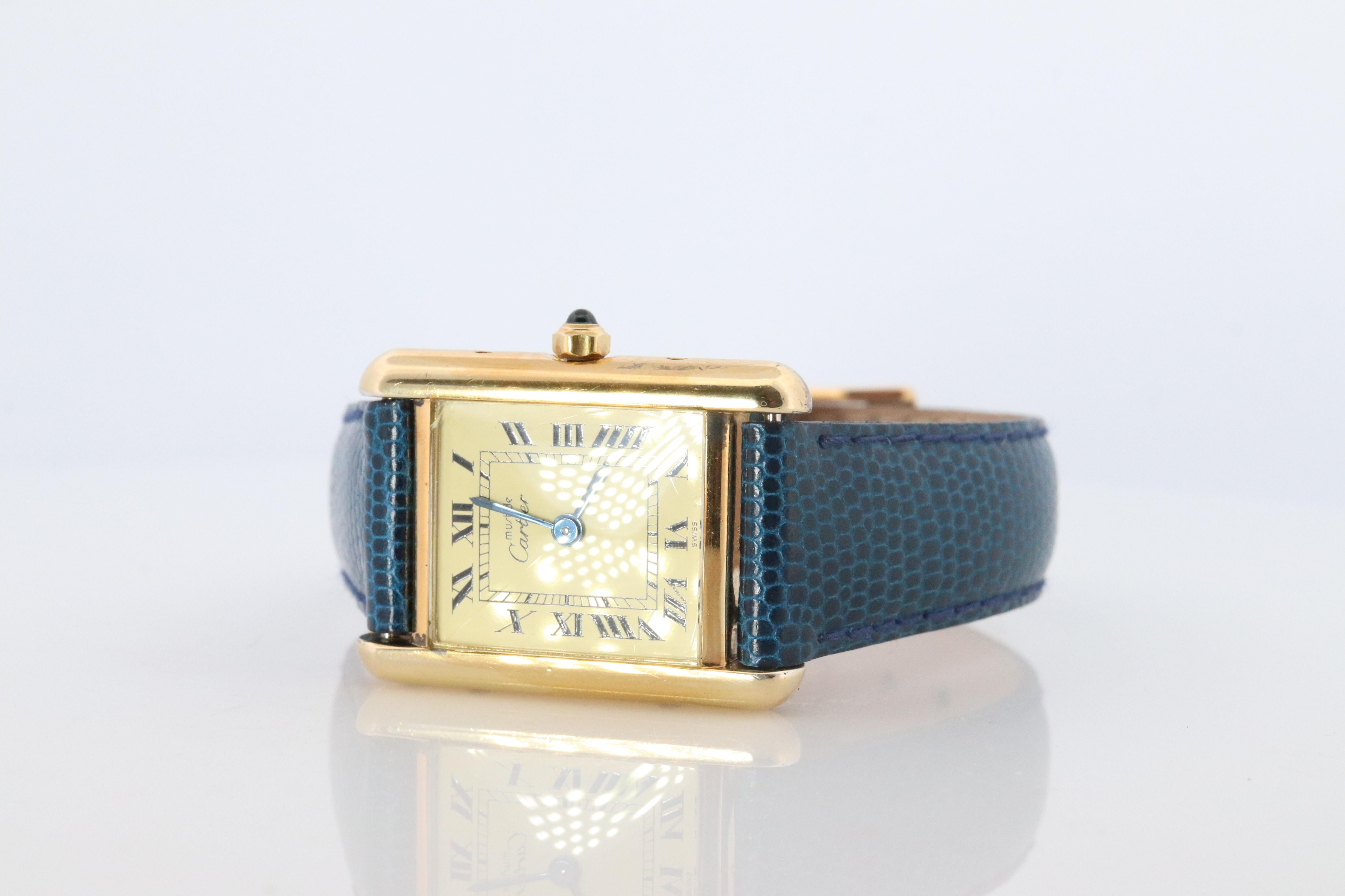 Genuine Cartier watch. Vintage Iconic Tank Argent. Sterling Silver and 18k Gold plated (Vermeil).

Ref 366001

Champagne Dial

Movement Just Serviced.

New Gucci Leather Band.

Condition: New Battery installed.

Details:
21mm by 28mm Case
Quartz