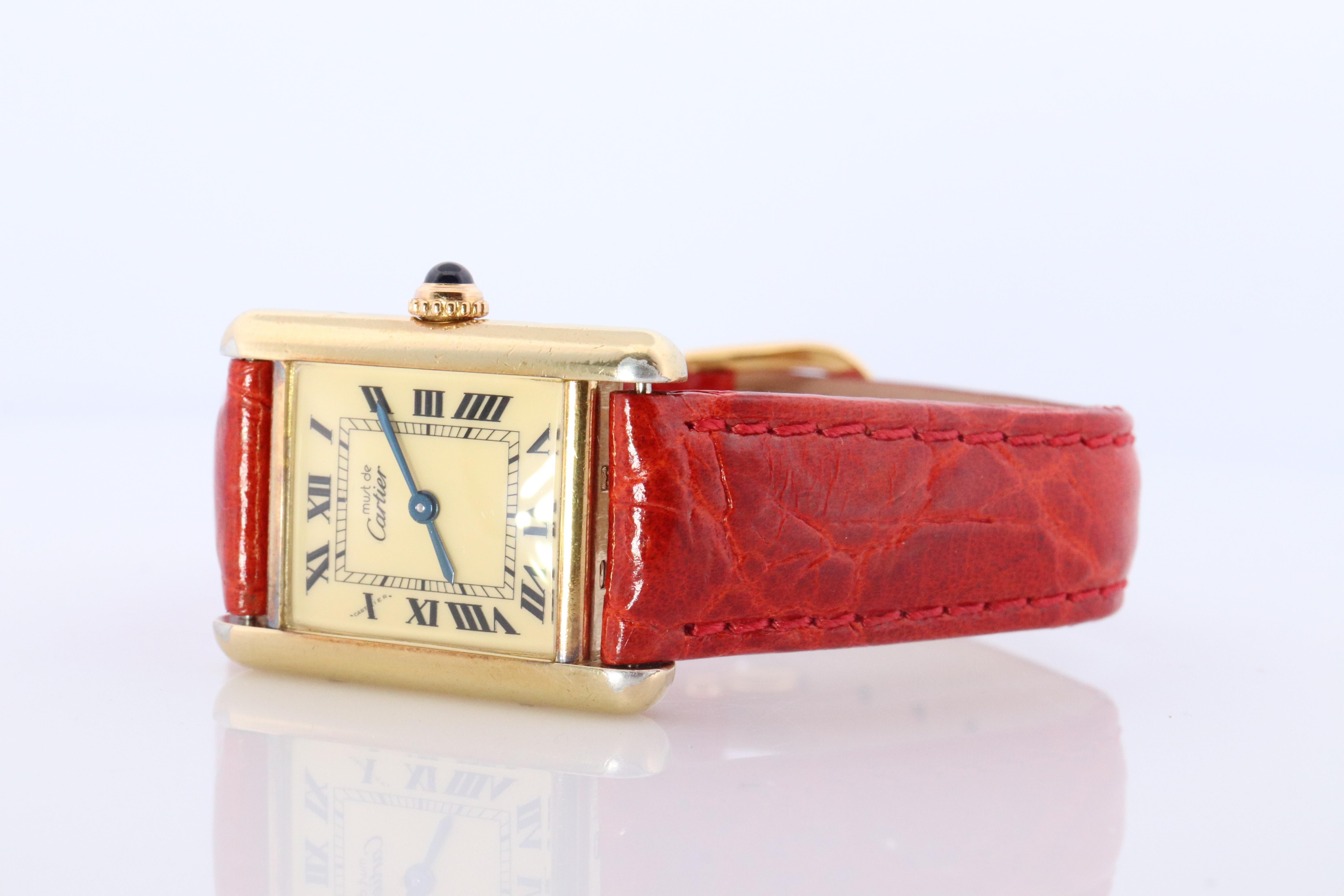 Genuine Cartier watch. Vintage Iconic Tank Argent. Sterling Silver and 18k Gold plated (Vermeil).

Ref 5057001

Champagne Dial

New  Leather Band.

Condition: New Battery installed.

Details:
21mm by 28mm Case
Quartz Battery Movement.

Please ask