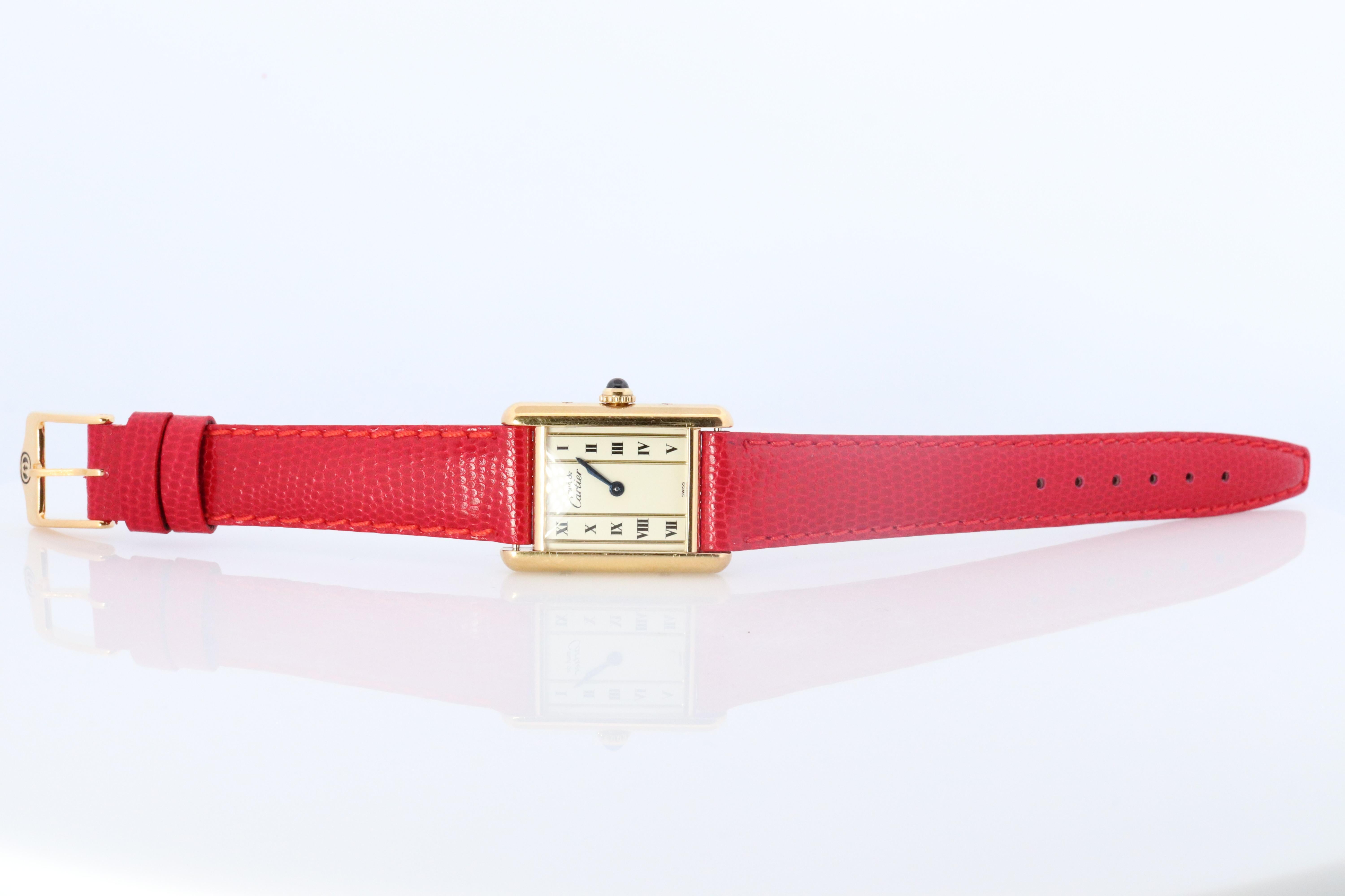 Genuine Cartier watch. Vintage Iconic Tank Argent. Sterling Silver and 18k Gold plated (Vermeil).

Ref 1613

RARE Pillar Roman Dial

New Gucci Leather Band.

Condition: New Battery installed.

Details:
21mm by 28mm Case
Quartz Battery