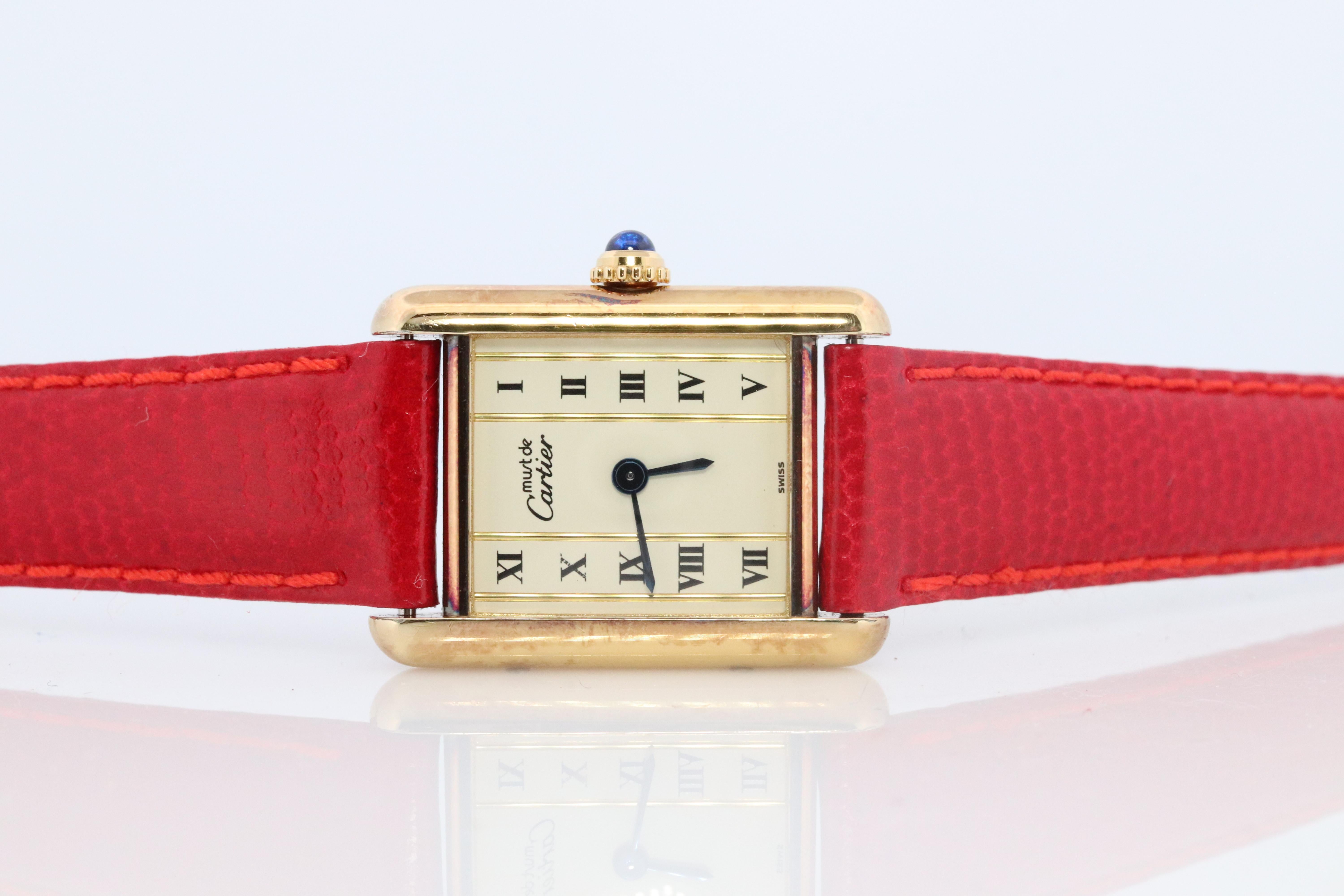 Genuine Cartier watch. Vintage Iconic Tank Argent. Sterling Silver and 18k Gold plated (Vermeil).

Ref 5057001

RARE Pillar Roman Dial

New Gucci Leather Band.

Condition: New Battery installed.

Details:
21mm by 28mm Case
Quartz Battery