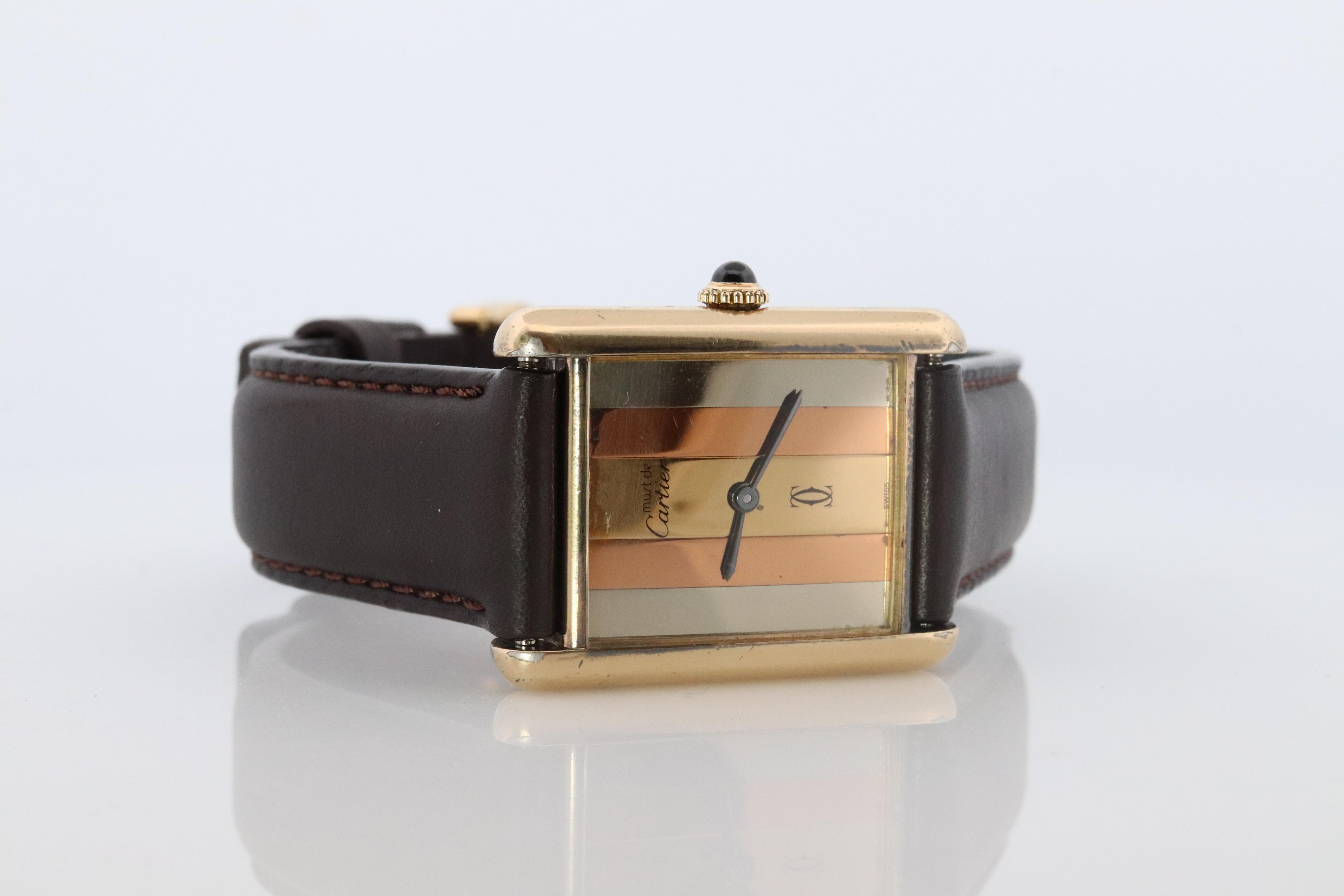 Genuine Cartier watch. Vintage Iconic Tank Argent. Sterling Silver and Gold plated (Vermeil).

ref 6166123

RARE Manual Windup Movement

Details:
24mm by 31mm Case
Tricolor Trinity Dial
Windup Manual Movement

New Gucci Leather band with Original
