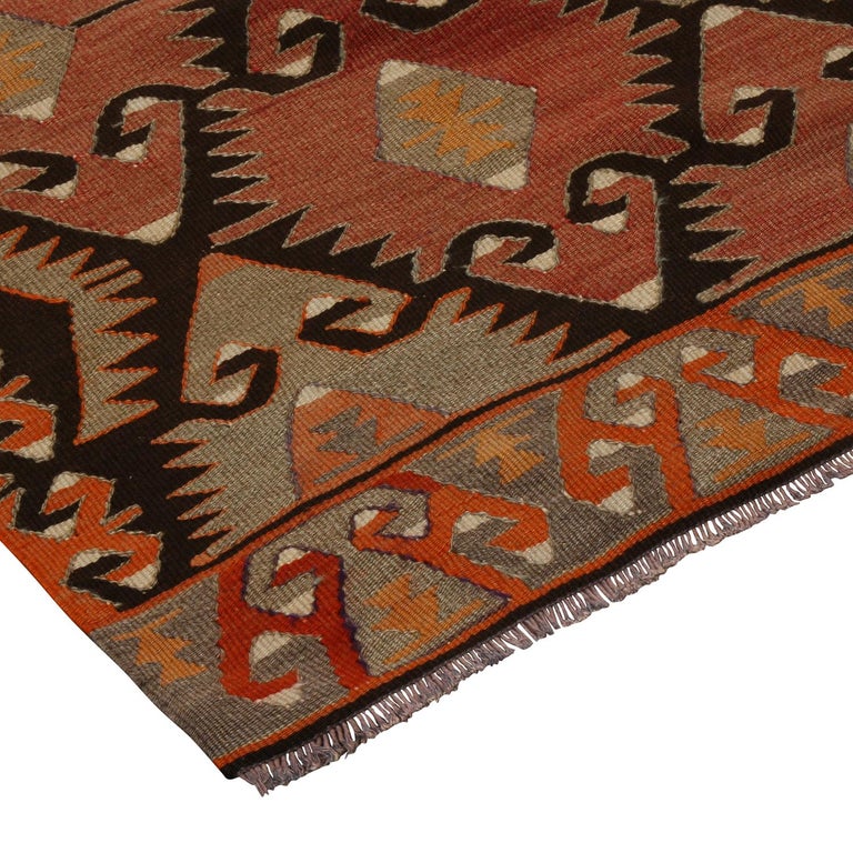 Flat-woven in high-quality wool originating from Turkey between 1930-1940, this vintage Mut Kilim rug boasts excellent condition and a unique departure from traditional Turkish colorway pageantry, marrying an unscathed sense of symmetry in the