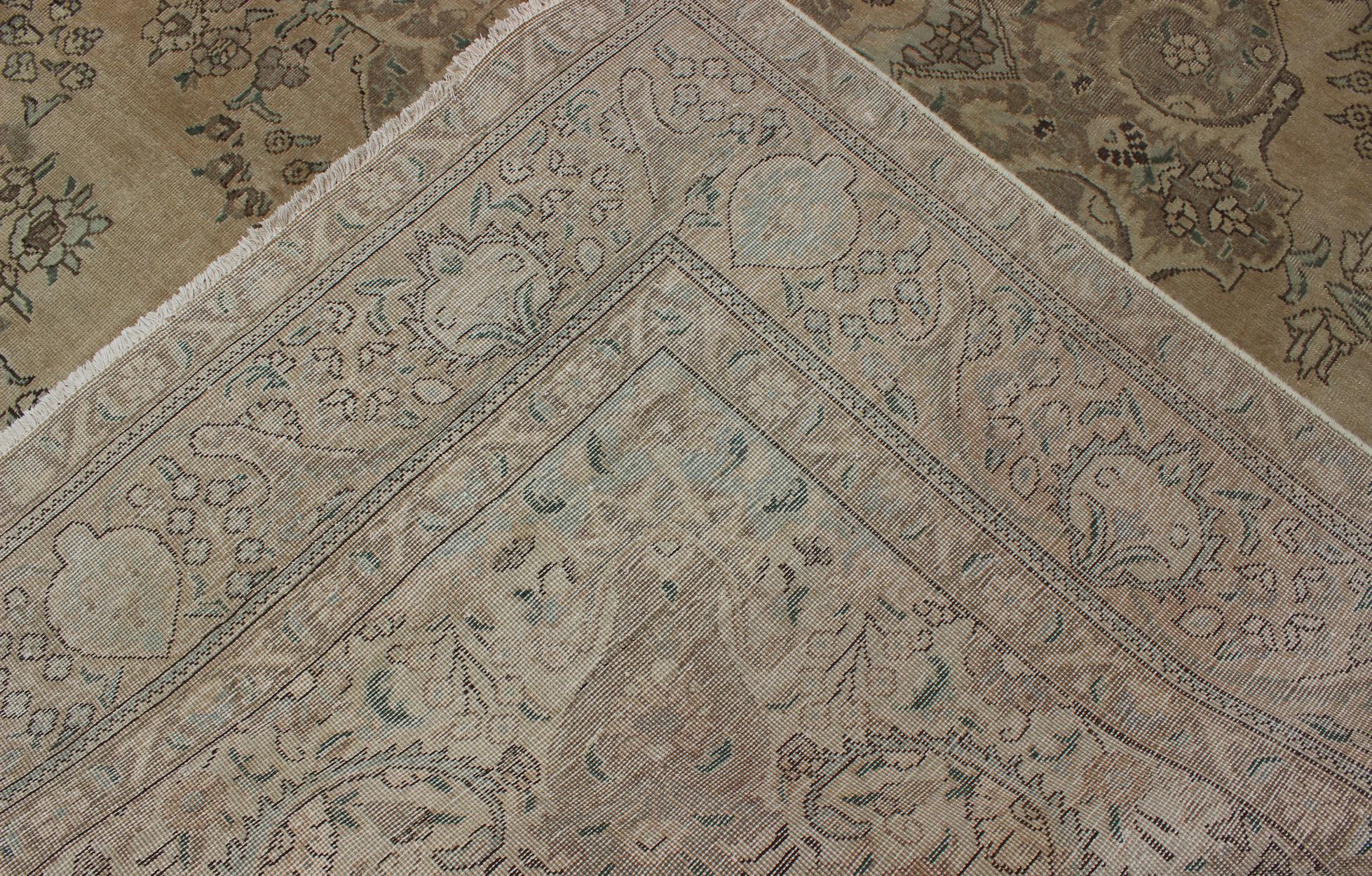 Wool Vintage Muted Persian Tabriz Rug With Large Floral Medallion in Earthy Tones For Sale