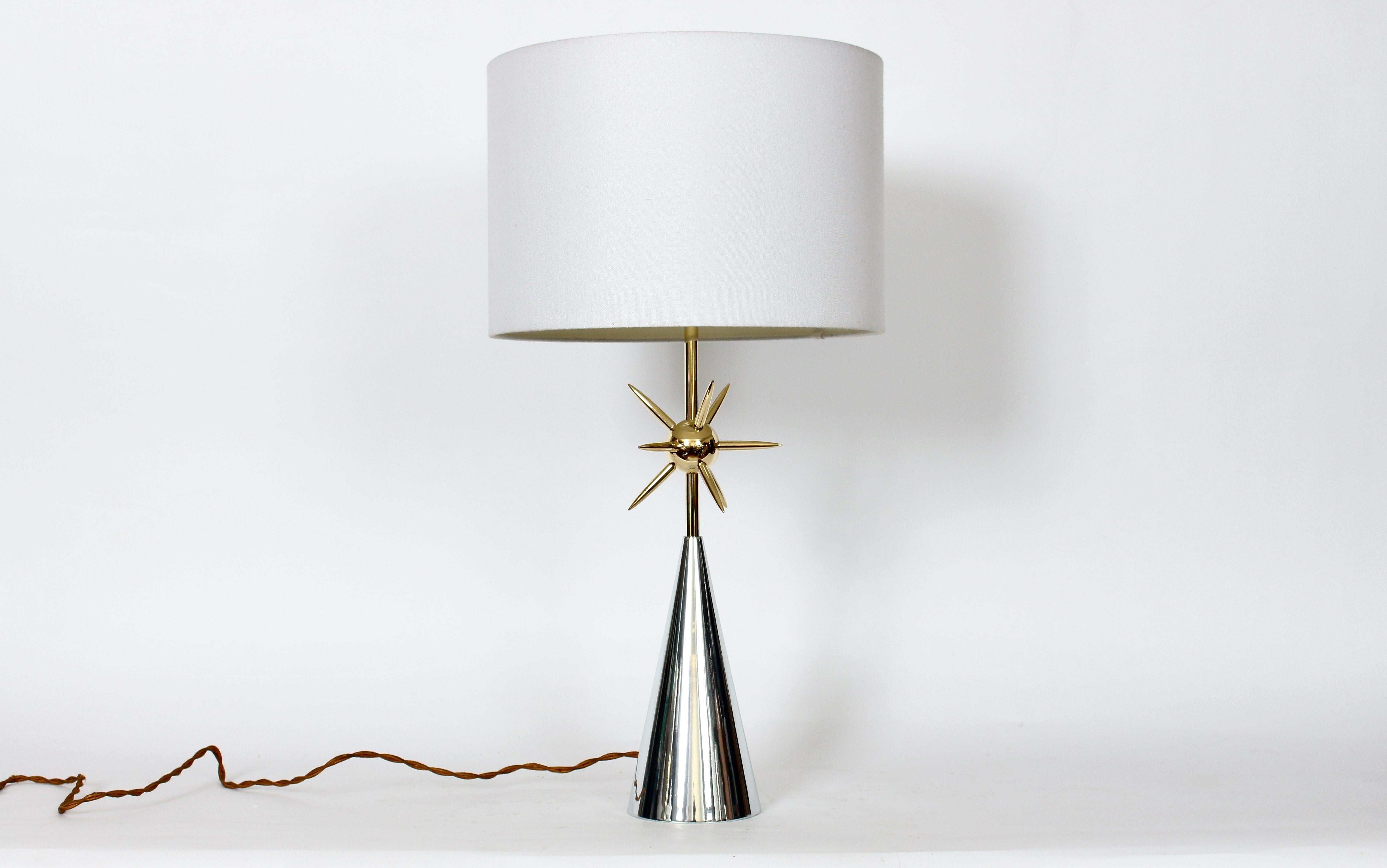 Original Mutual Sunset Lamp Co. attributed Atomic Sputnik Polished Mixed Metal Table Lamp. In the manner of Tommi Parzinger. Hollywood Regency style. Featuring a sturdy, repolished, reflective Aluminum (5D) conical base, detailed with a bright Brass