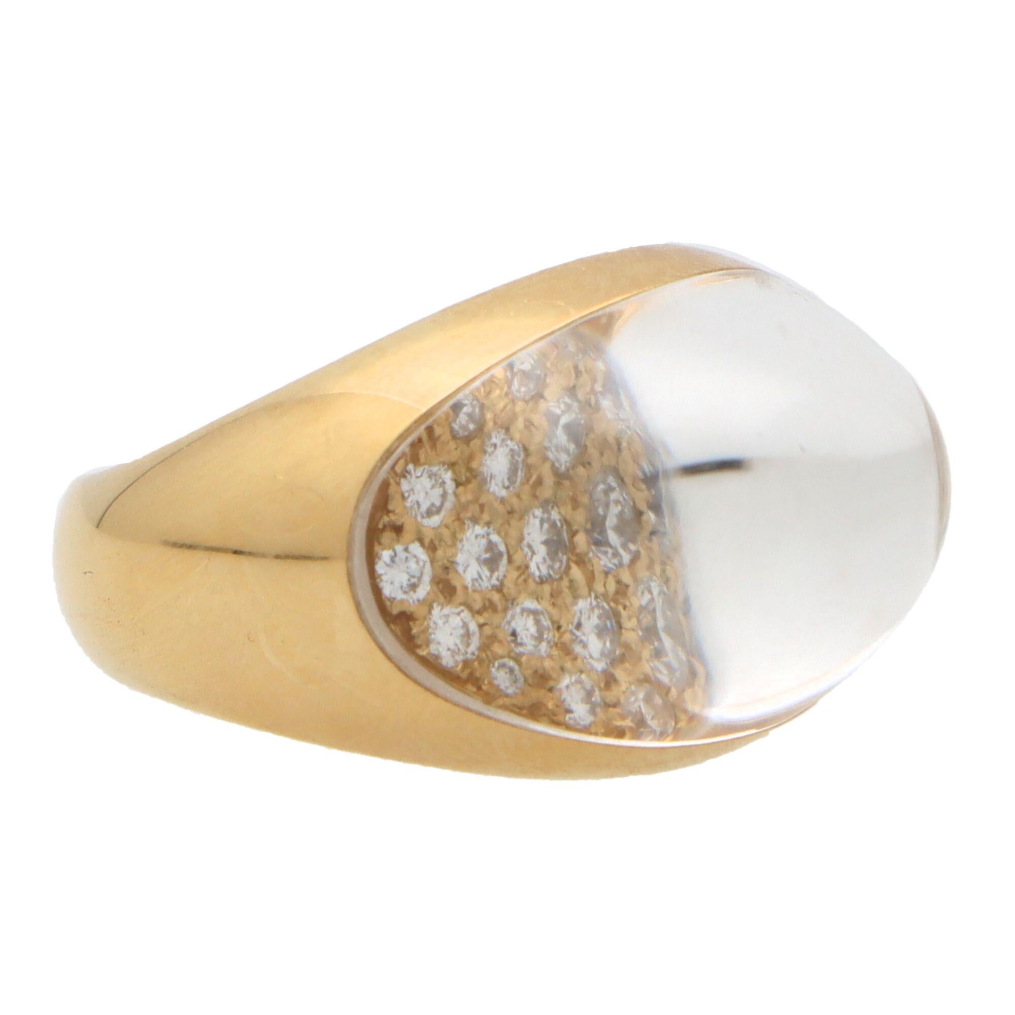 A beautiful vintage Cartier rock crystal and diamond dress ring from the Myst de Cartier collection set in 18k yellow gold.

The ring is set with an array of round brilliant cut diamonds with an overlay of clear rock on top. This is the encased in a