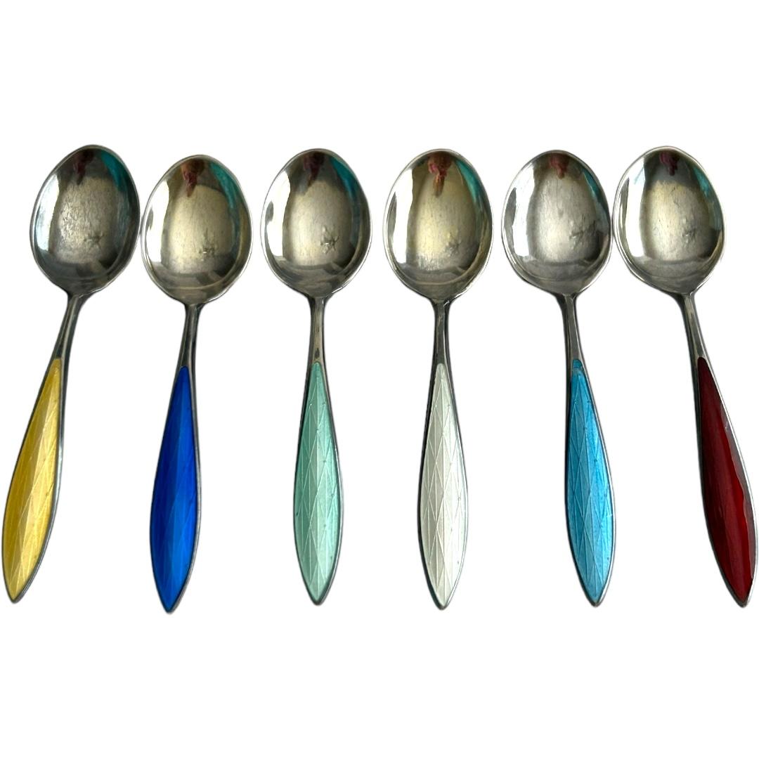 Enhance your collection with these exquisite demitasse spoons by N.M. Thune.  Crafted with utmost precision and made of authentic sterling silver, these spoons exude elegance and charm.  The intricate details on the spoons are further accentuated by