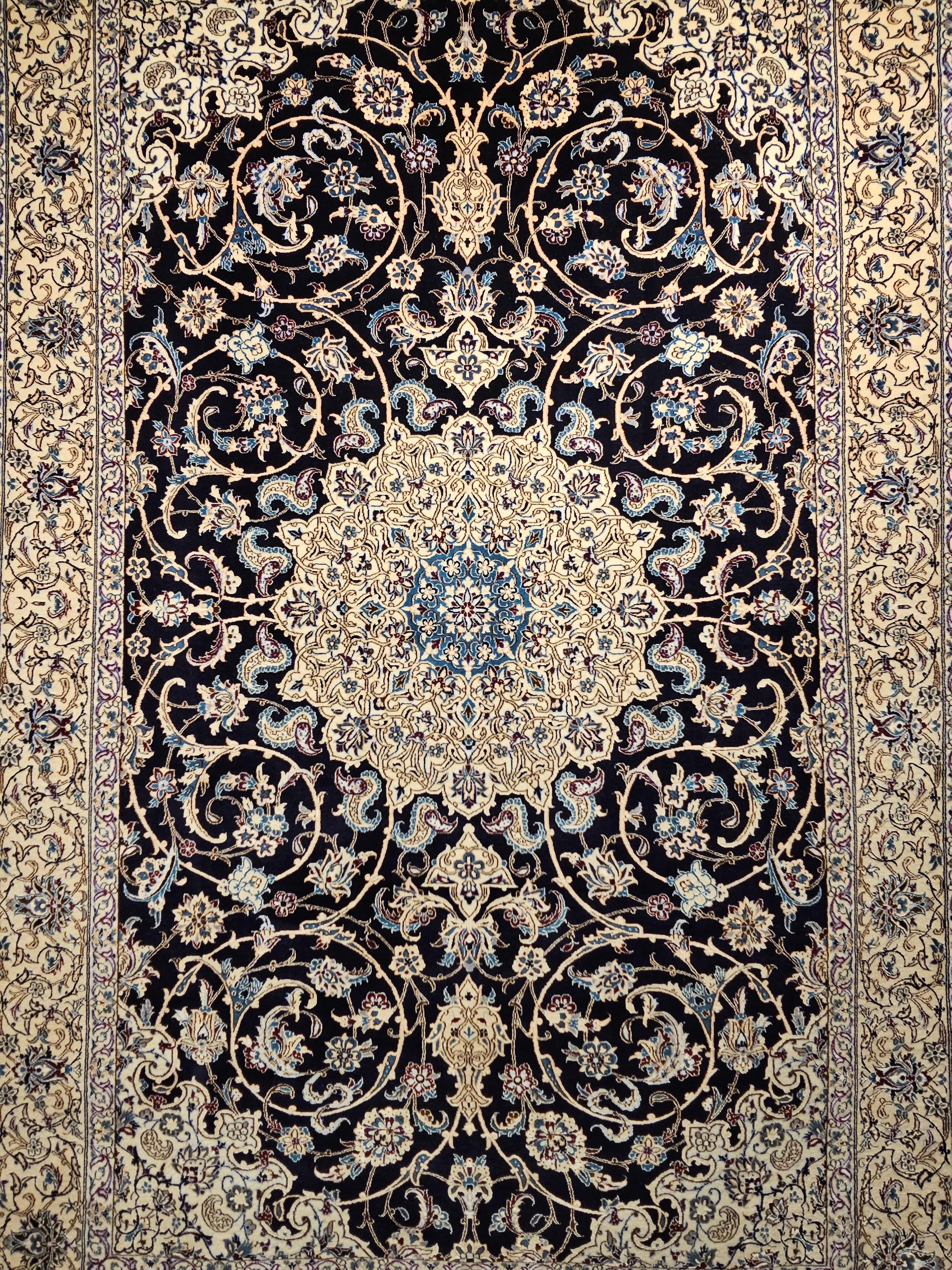  Extra fine weave Persian Nain area rug from the 4th quarter of the 1900s in navy blue, French blue, pale yellow, and ivory colors.   The rug has the signature of the “Habibian” which is considered one of the best rug workshops in the city of Nain. 