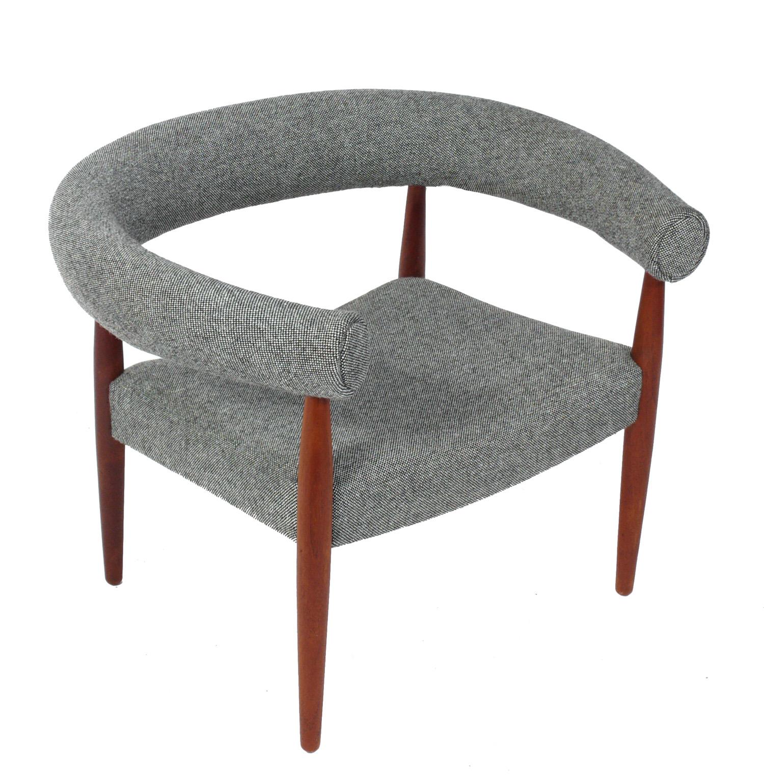 Sculptural vintage ring lounge chair, designed by Nanna and Jorgen Ditzel for Denmark, circa 1960s. It has recently been reupholstered in a micro-check black and white Maharam fabric, and the teak frame has been recently cleaned and Danish oiled.