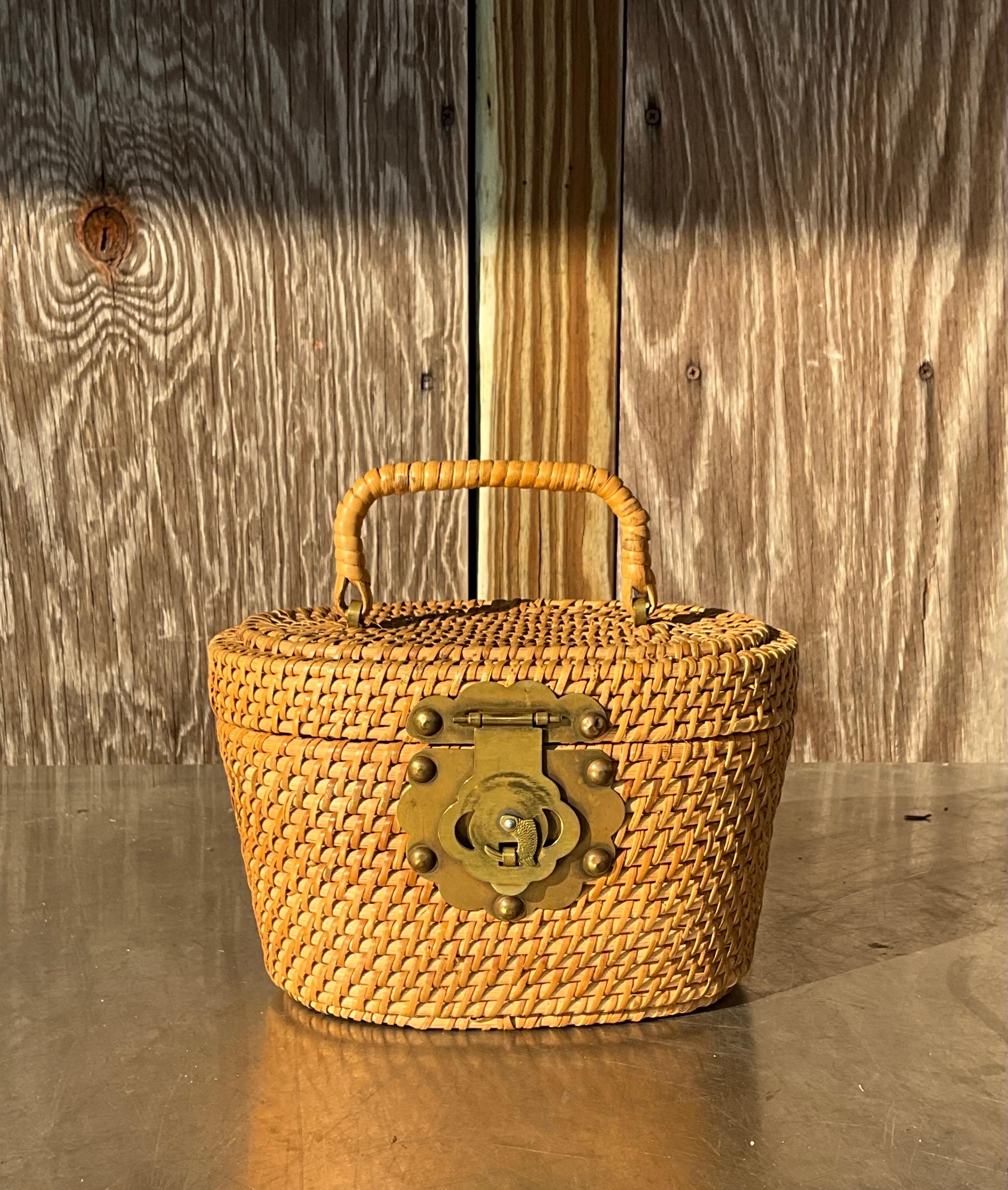 A Vintage Nantucket Rattan Basket Bucket Bag is an elegant and timeless accessory that combines the natural beauty of rattan weaving with a functional, yet chic design. Known for its craftsmanship and coastal-inspired aesthetic, this type of bag