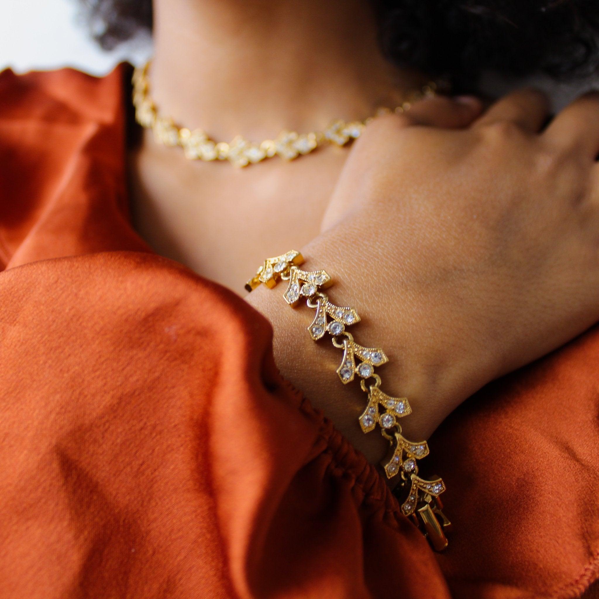 Vintage Napier Bracelet in in Gold Plated Metal and Crystal, 1980s

Beautiful bracelet from one of the world's most famous costume jewellers.  Made in the USA in the 1980s, this bracelet is crafted for gold plated metal and set with tiny