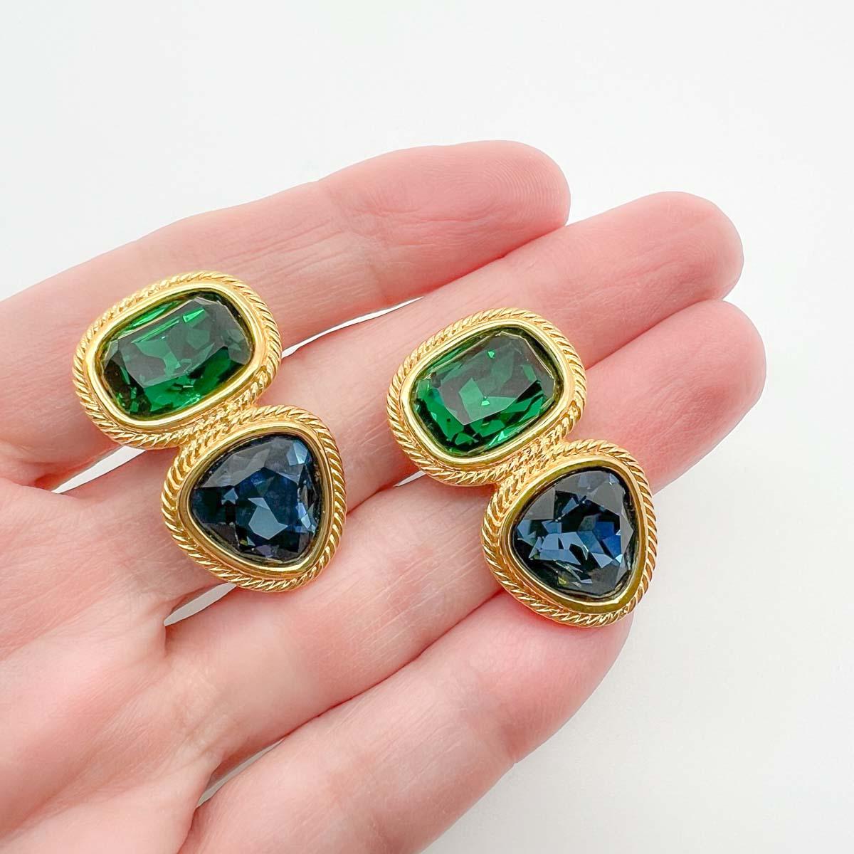 Vintage Napier Crystal Earrings. Heavenly deep emerald green and deep sapphire blue combine in a lustrous golden setting to create the most perfect finishing touch.
American costume jewellery company Napier founded in the 1880s were revered for