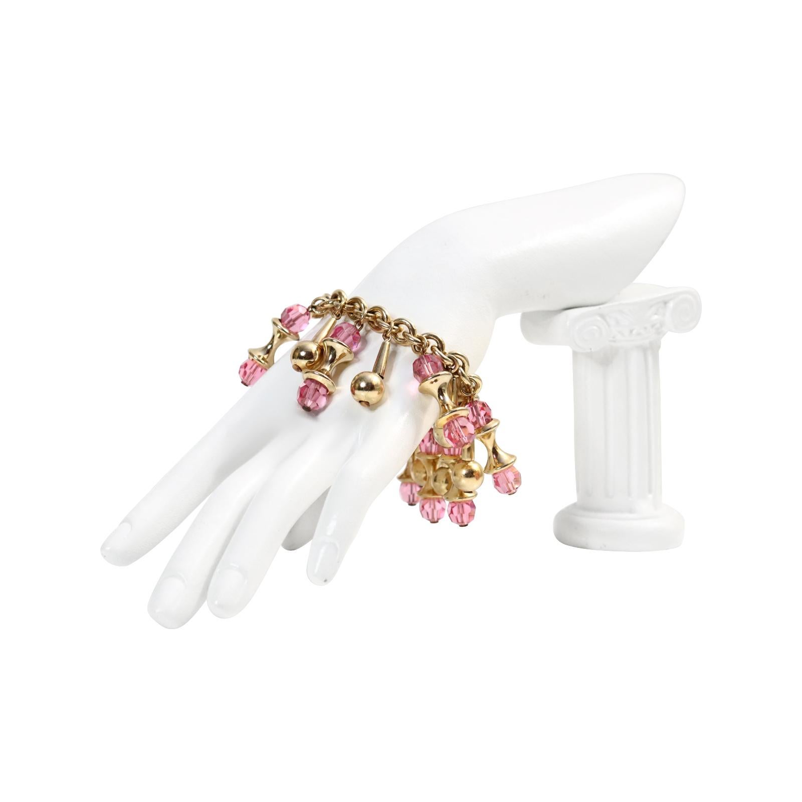 Vintage Napier Gold Tone Dangling Pink Bracelet Circa 1960s.  One of the older Napier bracelets.  Every now and then, I come across one of the older Napier pieces that sets me on fire, and this is one of those pieces. It is a well-made and