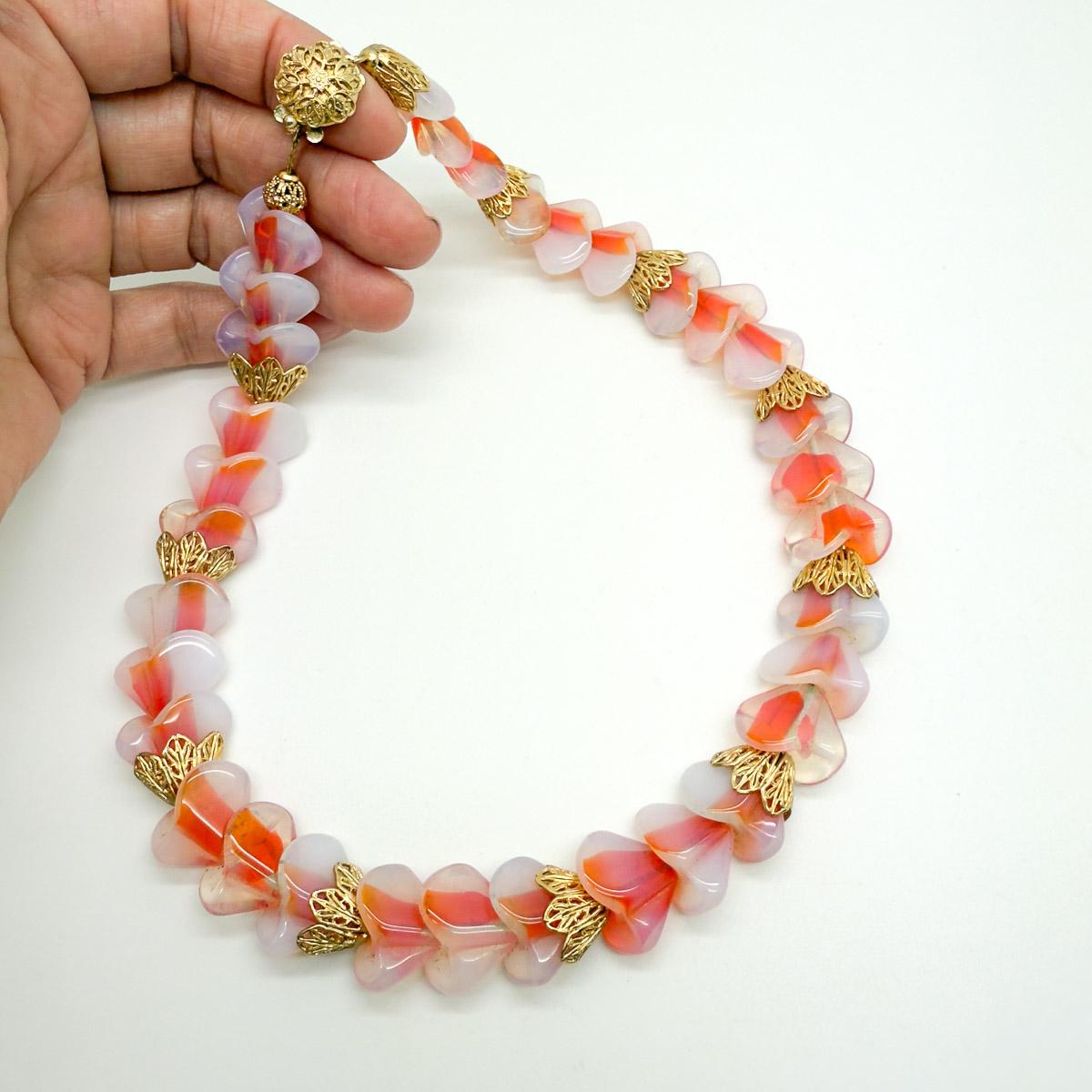 A captivating and unusual Vintage Napier Opaline Glass Necklace and Earring Set. Featuring the most adorable delicate opaline art glass crafted with a contrasting vibrant coral centre. The artistry continues with the unique shape of the glass