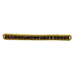 Broche de diseño vintage NAPIER firmado en tono dorado con cristales de amatista