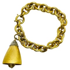 Pulsera vintage NAPIER firmada en tono dorado con cadena de dijes de campana de diseño