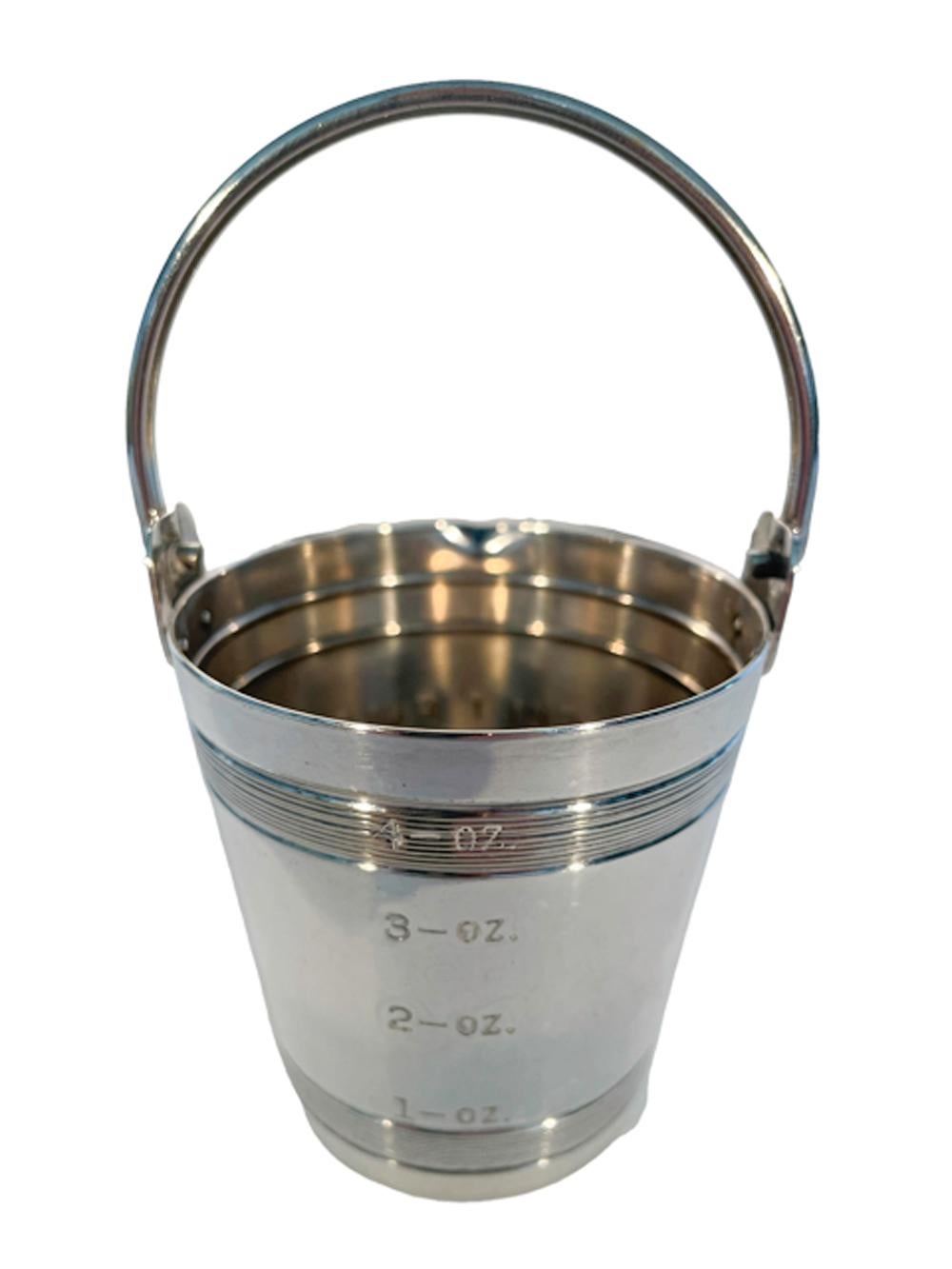 Art Deco 4 once silver plate spirit measure by Napier in the form of a pail with bail handle and raised ring and engin turned bands, calibrated on the back 1oz through 4oz and engraved 