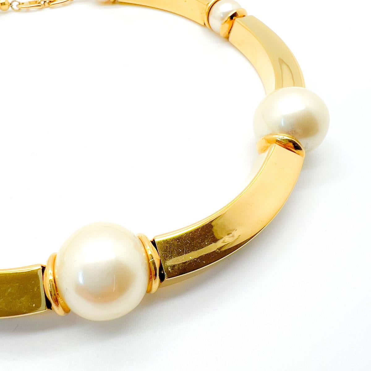 A fabulous Vintage Napier Pearl Collar. Bold gold curved bars interspersed with huge faux pearls. Timeless yet edgy. An absolute find from the House of Napier. The Napier Jewellery Company can trace its origins back to the 1880s. Always at the