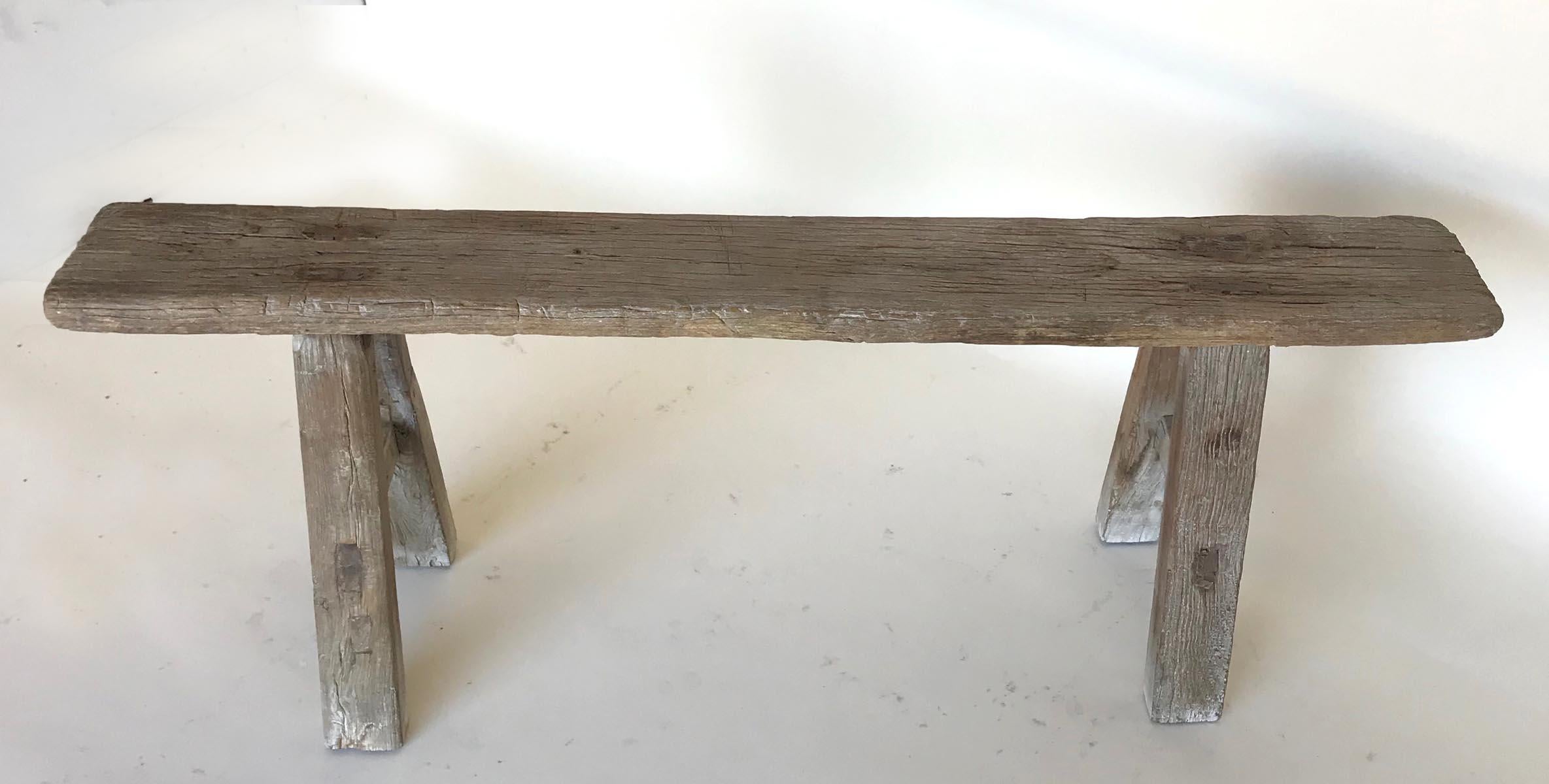 Vintage narrow elm bench with mortise and Tenon construction and smooth weathered patina.