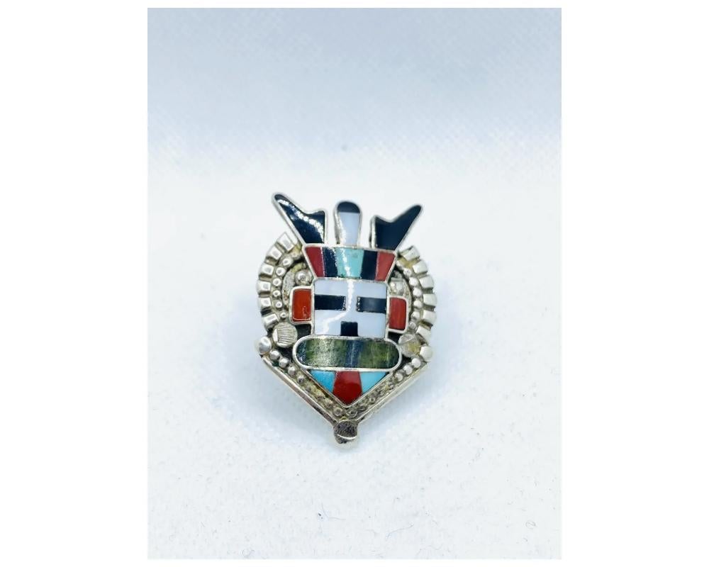 Native American Chief Ring Zuni Signed Inlay 
Turquoise 
Coral 
Onyx 
Mother of pearl 
heard stone 
In great condition some minor light scratches consistent with age 
the size of the ring is approximately 5 ½ please see photo for exact size 
the