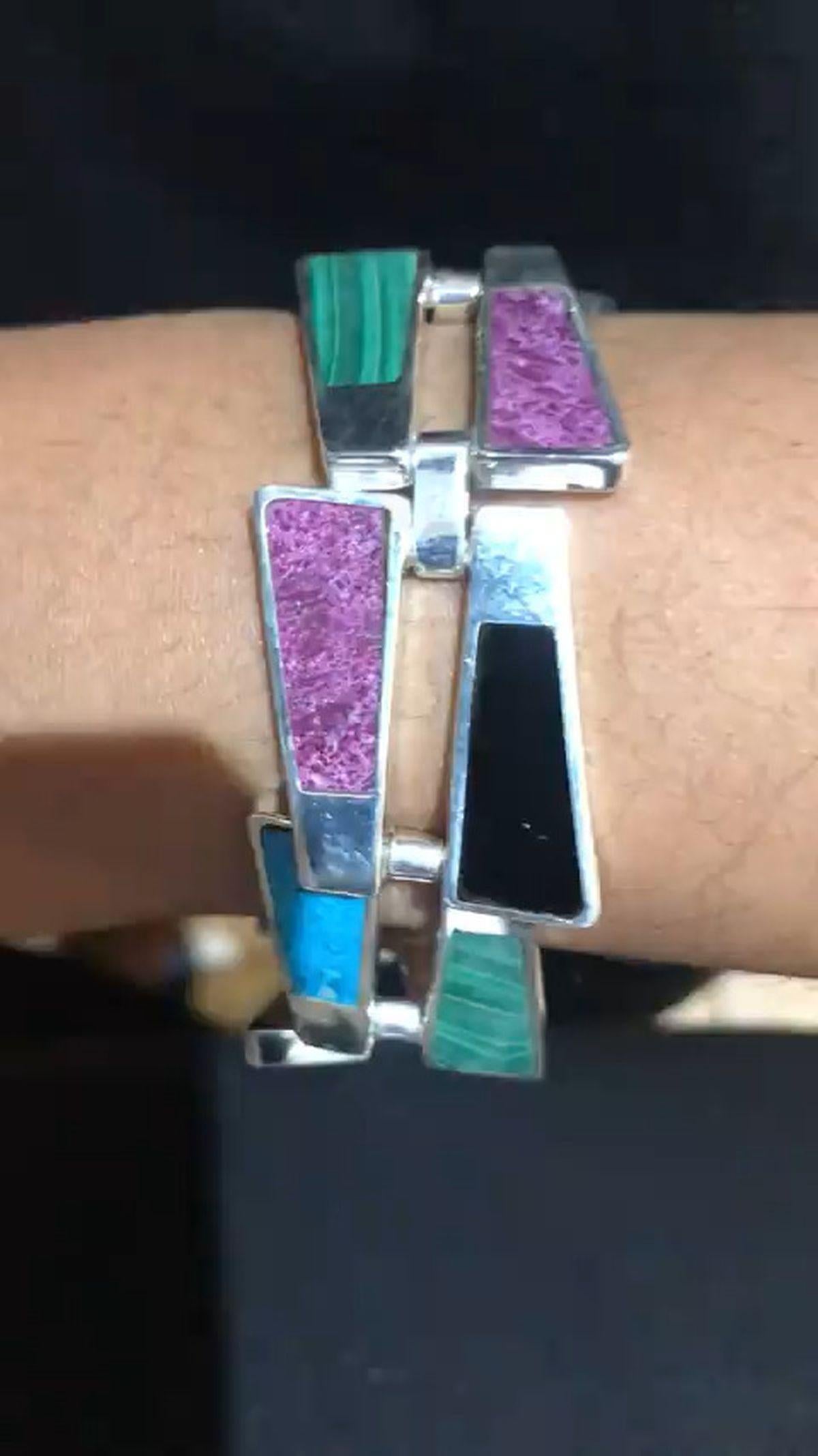 Simply Beautiful! Vintage Native American Navajo Hand Crafted Sterling Silver Multi Gem Link Bracelet. Hand set in Sterling surround with Onyx, Amethyst, Turquoise, Malachite and Lapis Lazuli Stylized Arrows. Measuring approx. 7.25” L x 0.75” W.