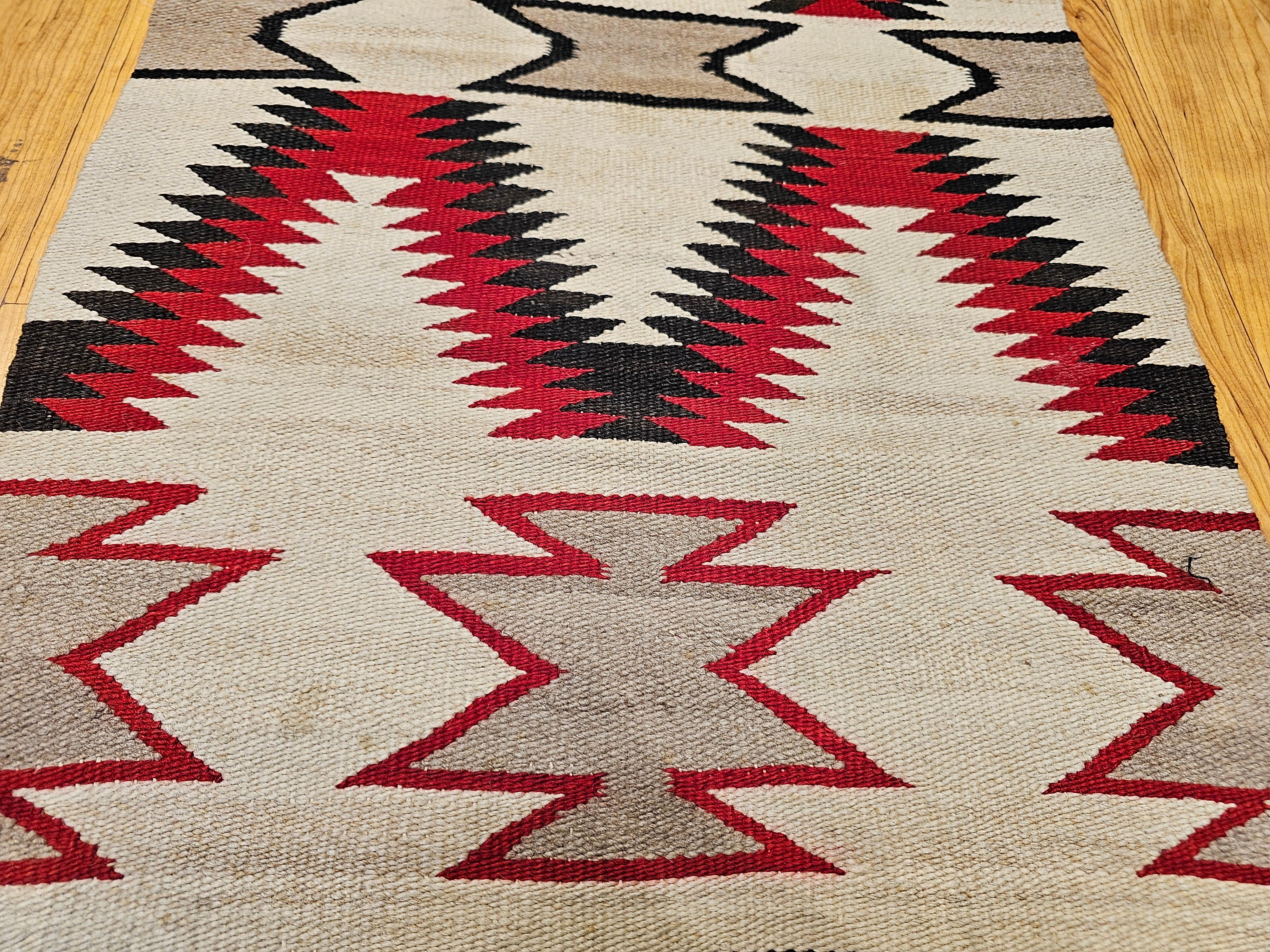 Vintage Native American Navajo Area Rug in Eye Dazzler Pattern in Ivory, Red For Sale 1
