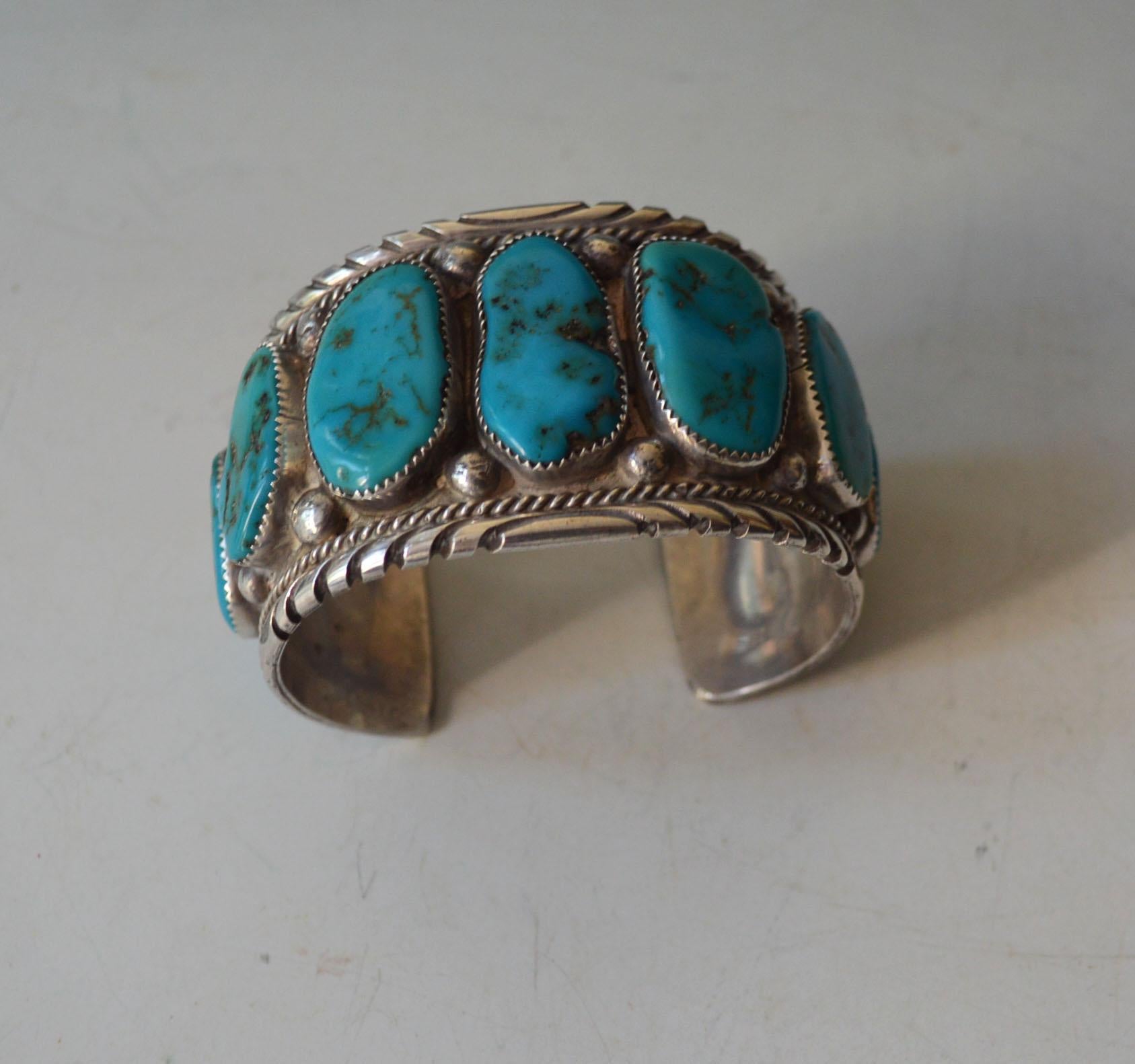 A fine vintage handcrafted Navajo sterling silver and turquoise cuff bracelet
A particularly fine and  attractive Navajo cuff bracelet with large turquoise cabochons stamped sterling with makers initials JT. Period 1960`s 
Measures: 3  x 2 1/4