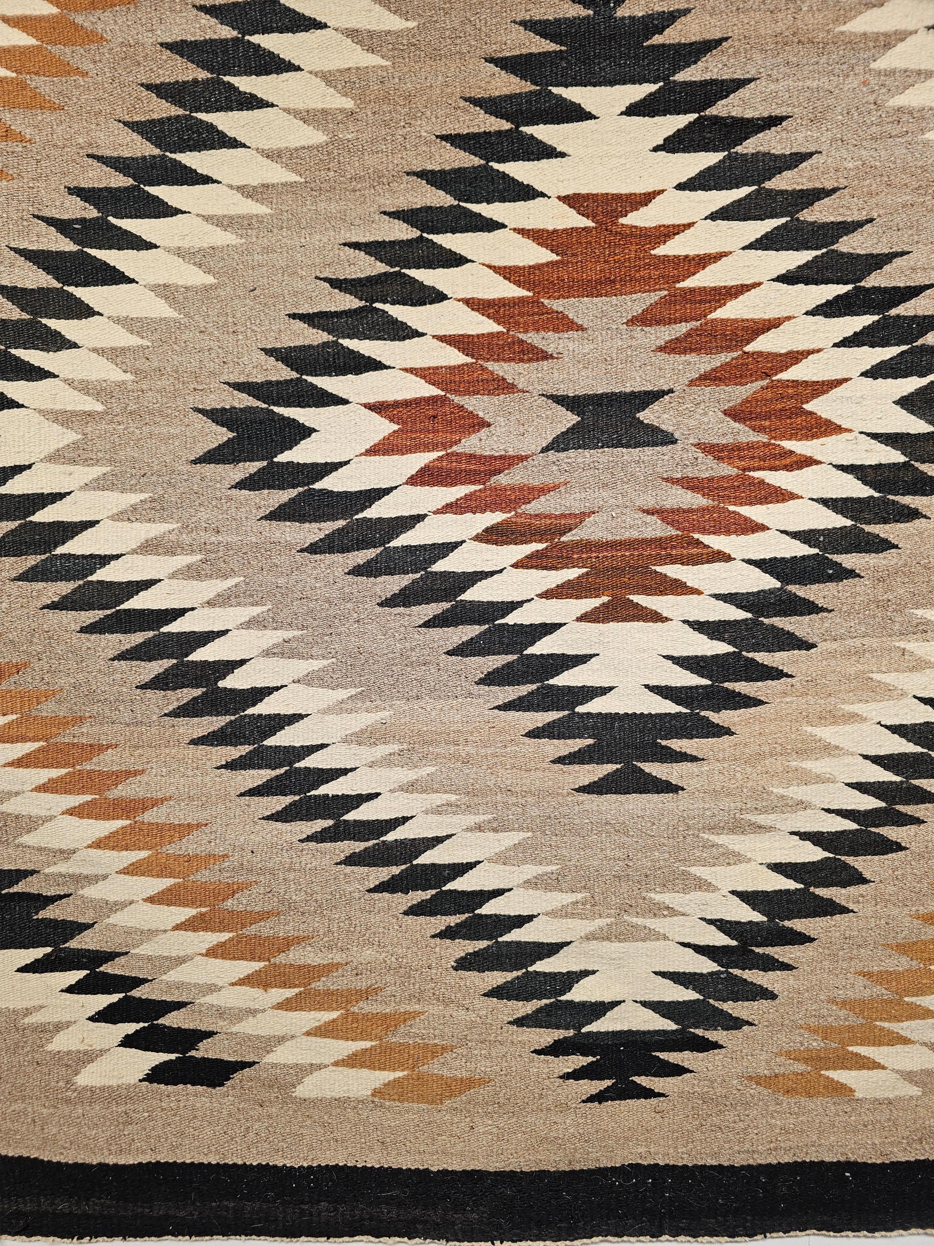 Vegetable Dyed Vintage Native American Navajo Rug in Eye Dazzler Pattern in Earth Tone Colors For Sale