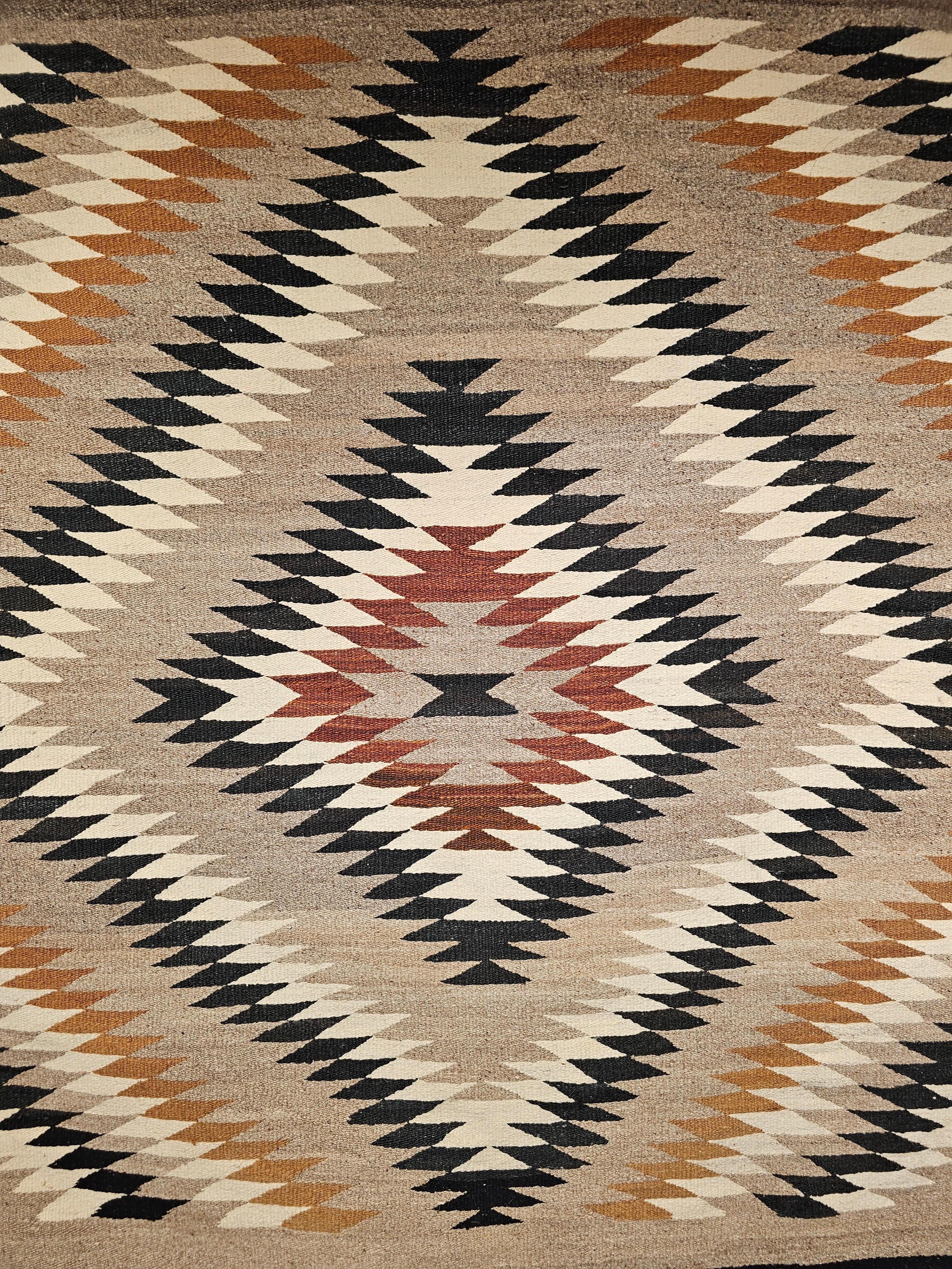 Vintage Native American Navajo Rug in Eye Dazzler Pattern in Earth Tone Colors In Good Condition For Sale In Barrington, IL