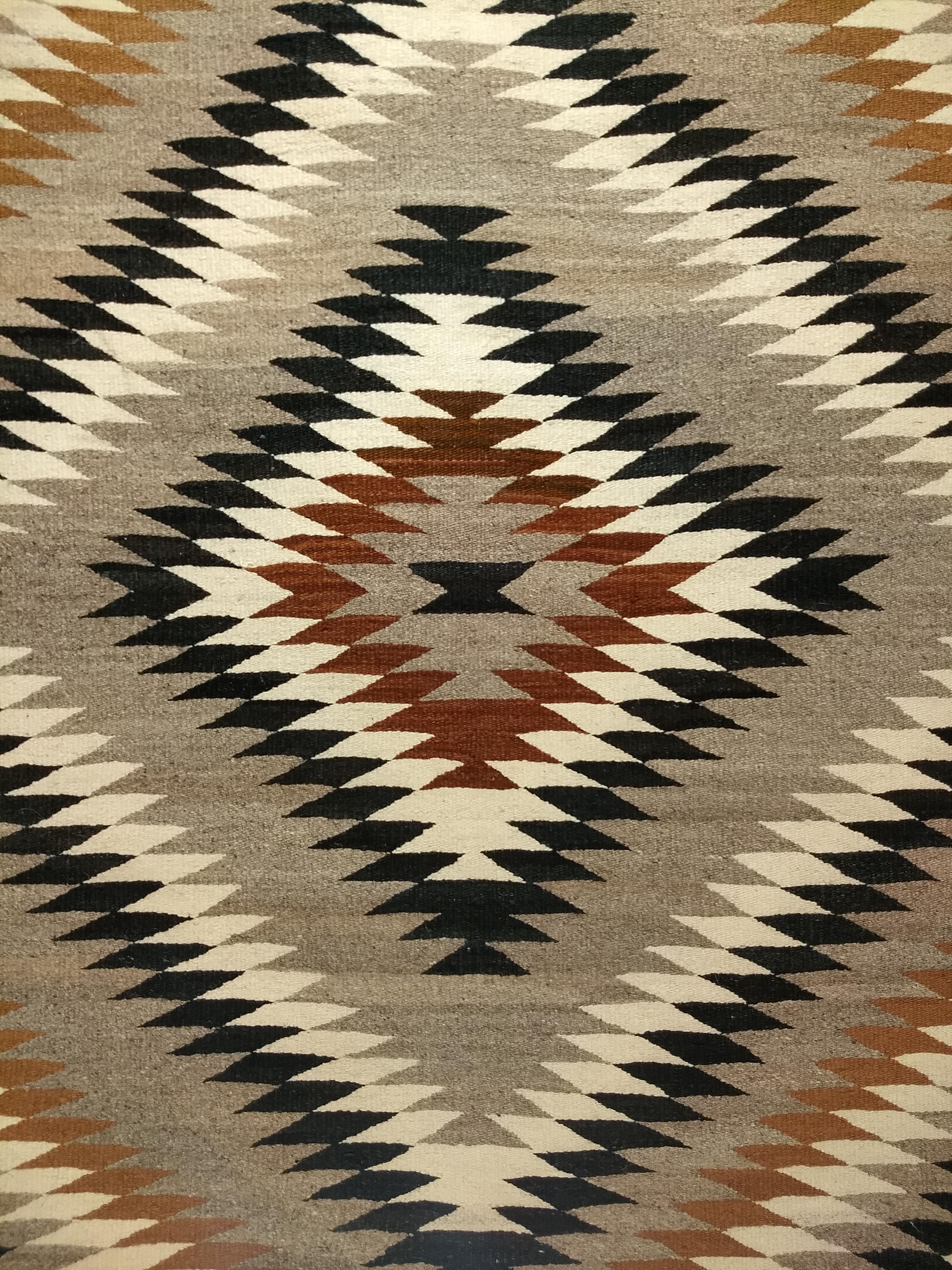 20th Century Vintage Native American Navajo Rug in Eye Dazzler Pattern in Earth Tone Colors For Sale