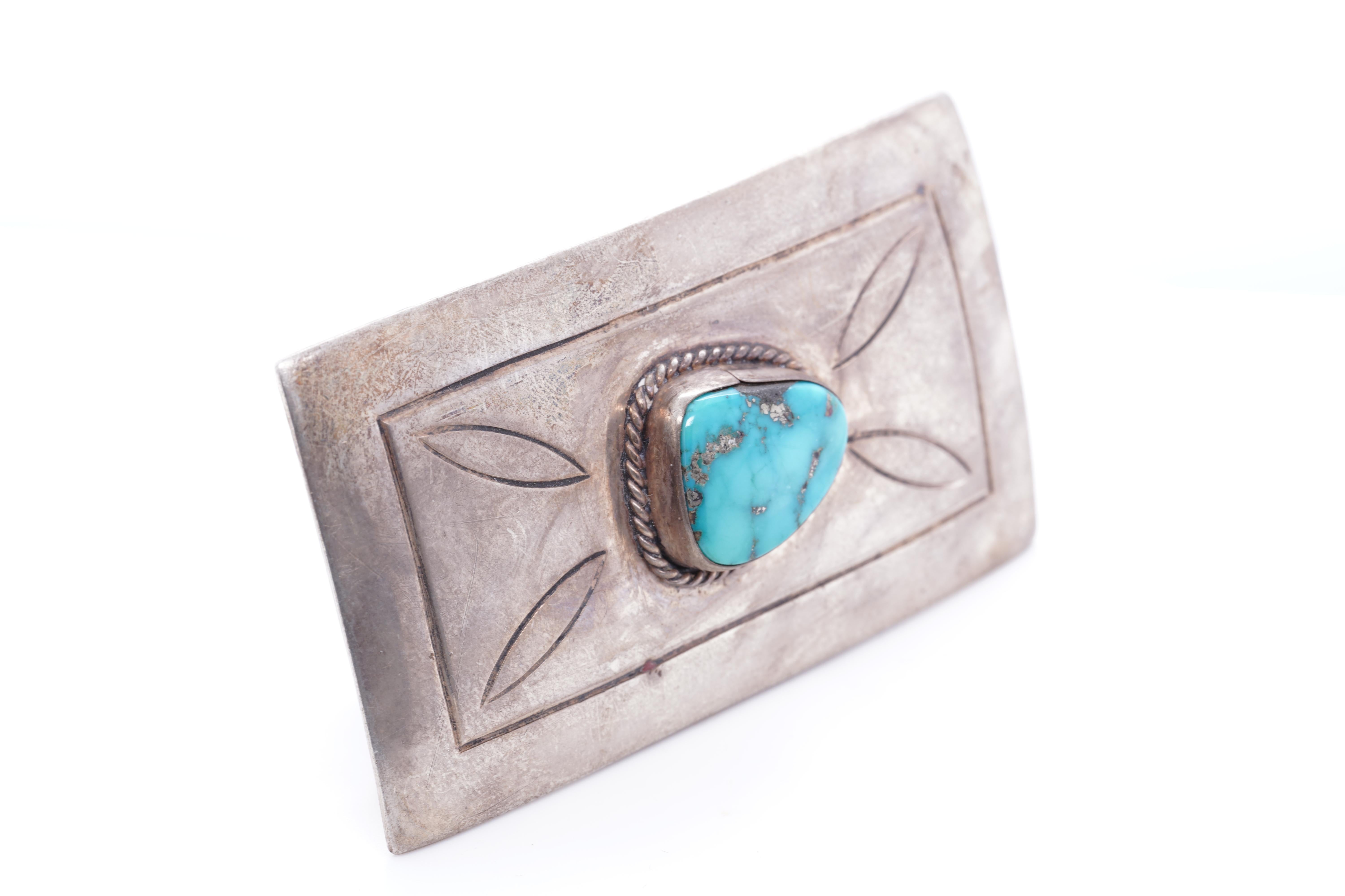 Vintage Native American Navajo Small, Sterling Silver Belt Buckle
Center stone stone measures: 13mm x 16.3mm
Total Weight: 30 grams of sterling silver and turquoise.
Size: small sized woman, fits 28.5mm 1.12 in
Measures 1.4inches (35.89mm) x 2.5 in