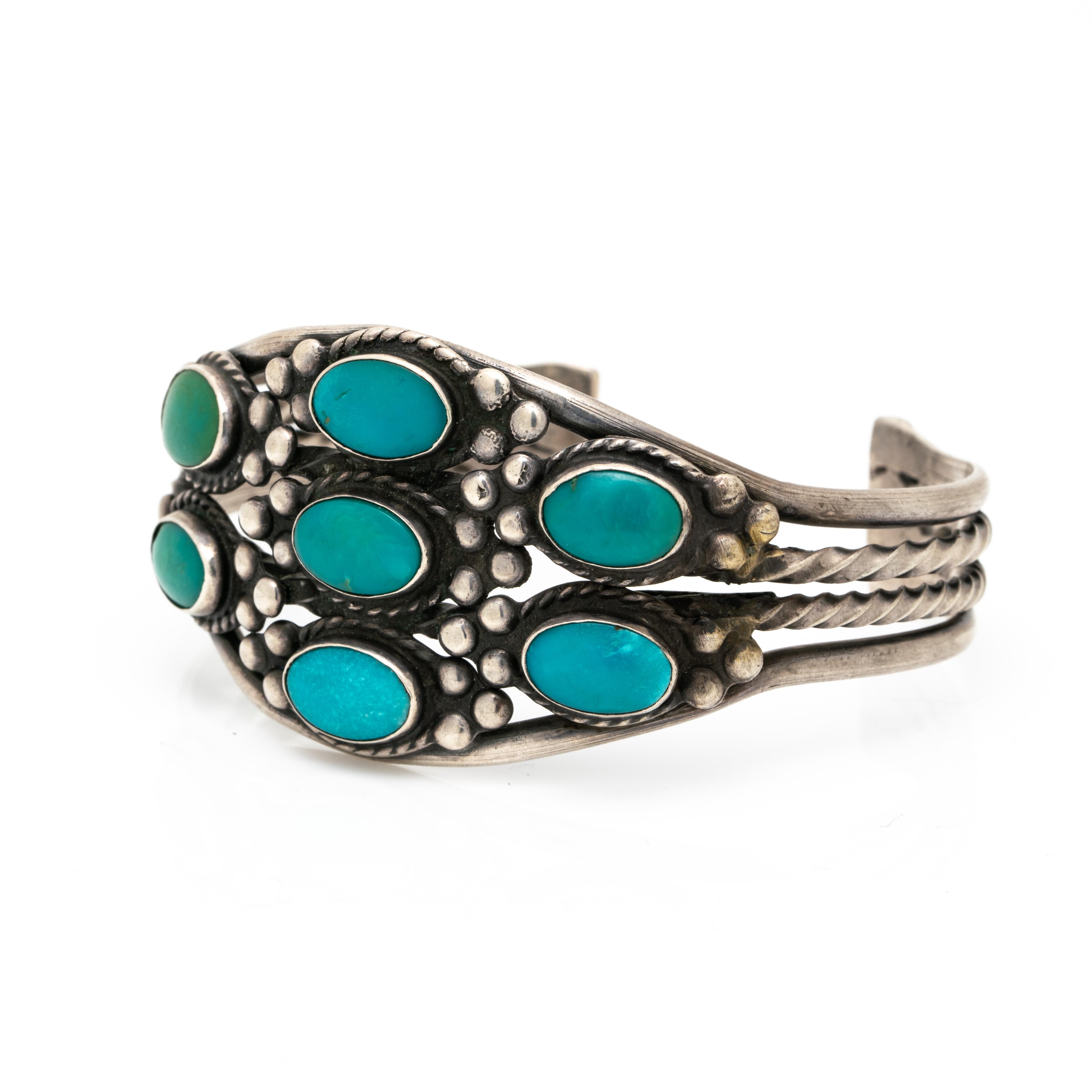 Native American Navajo Turquoise Bracelet c. 1950s
Hand engraved and hand forged. A wonderful Navajo cuff!

The patina of the silver is oxidized, we do not clean vintage and antique silver pieces as some clients prefer them in their natural oxidized