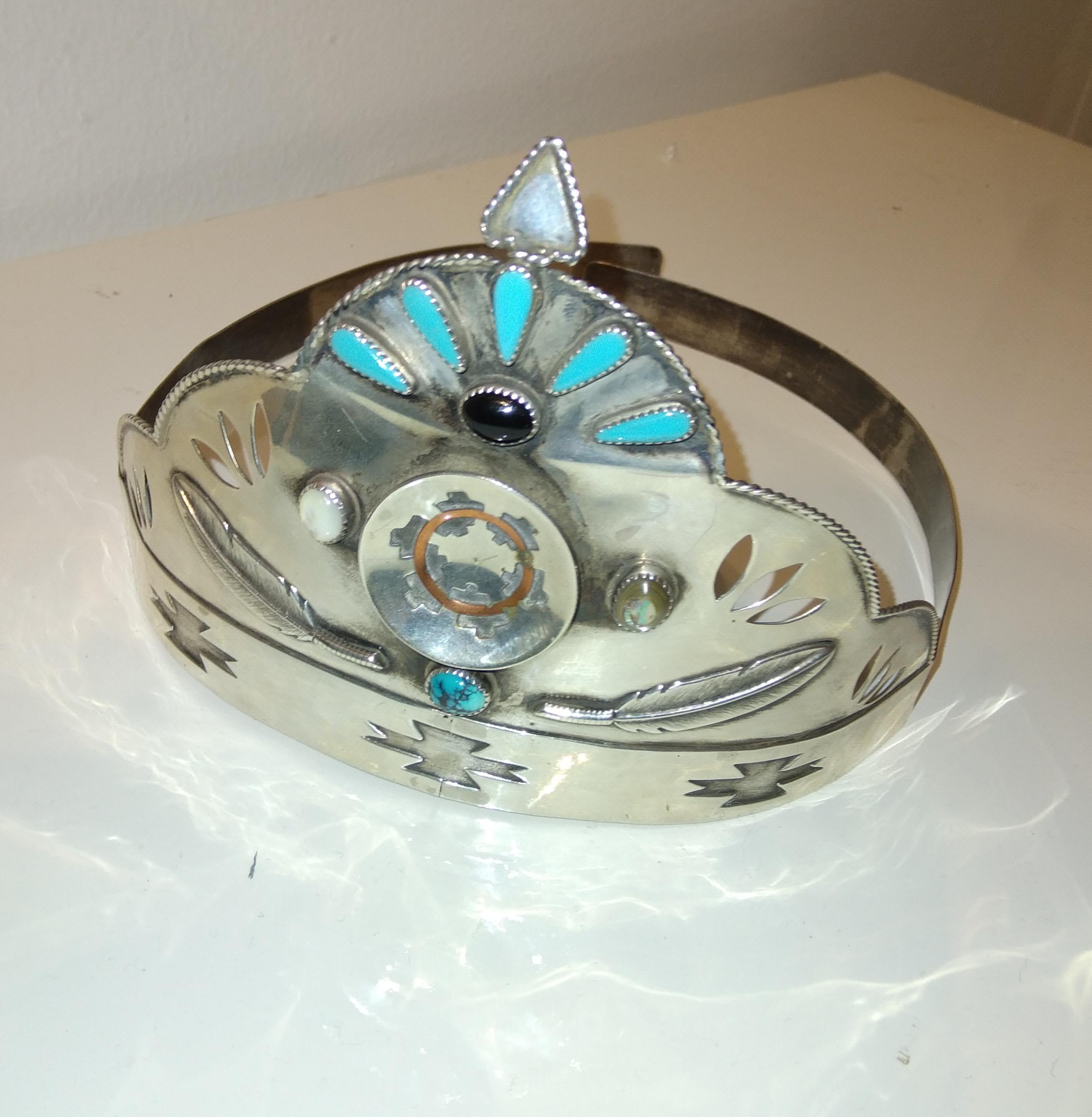 A fine silver Navajo silver and turquoise Crown or Tiara 

This type of Tiara is made for a beauty pageant held once a year in Arizona. The Tiara is presented to the winner . This particularly fine and beautifully made piece shows the full skills of