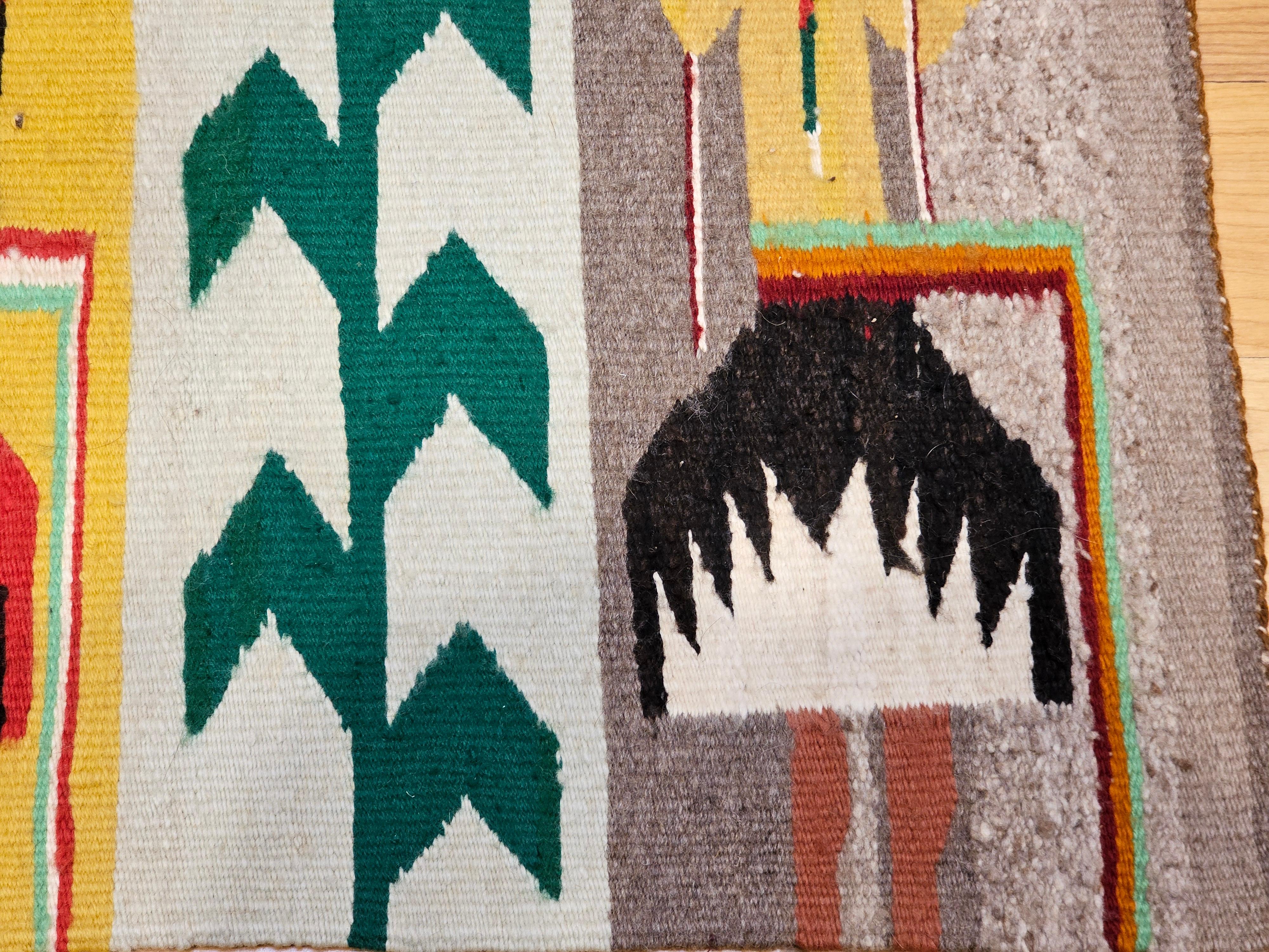 Laine Tapis pictural Navajo Yei amérindien vintage en ivoire, rouge, jaune, vert en vente
