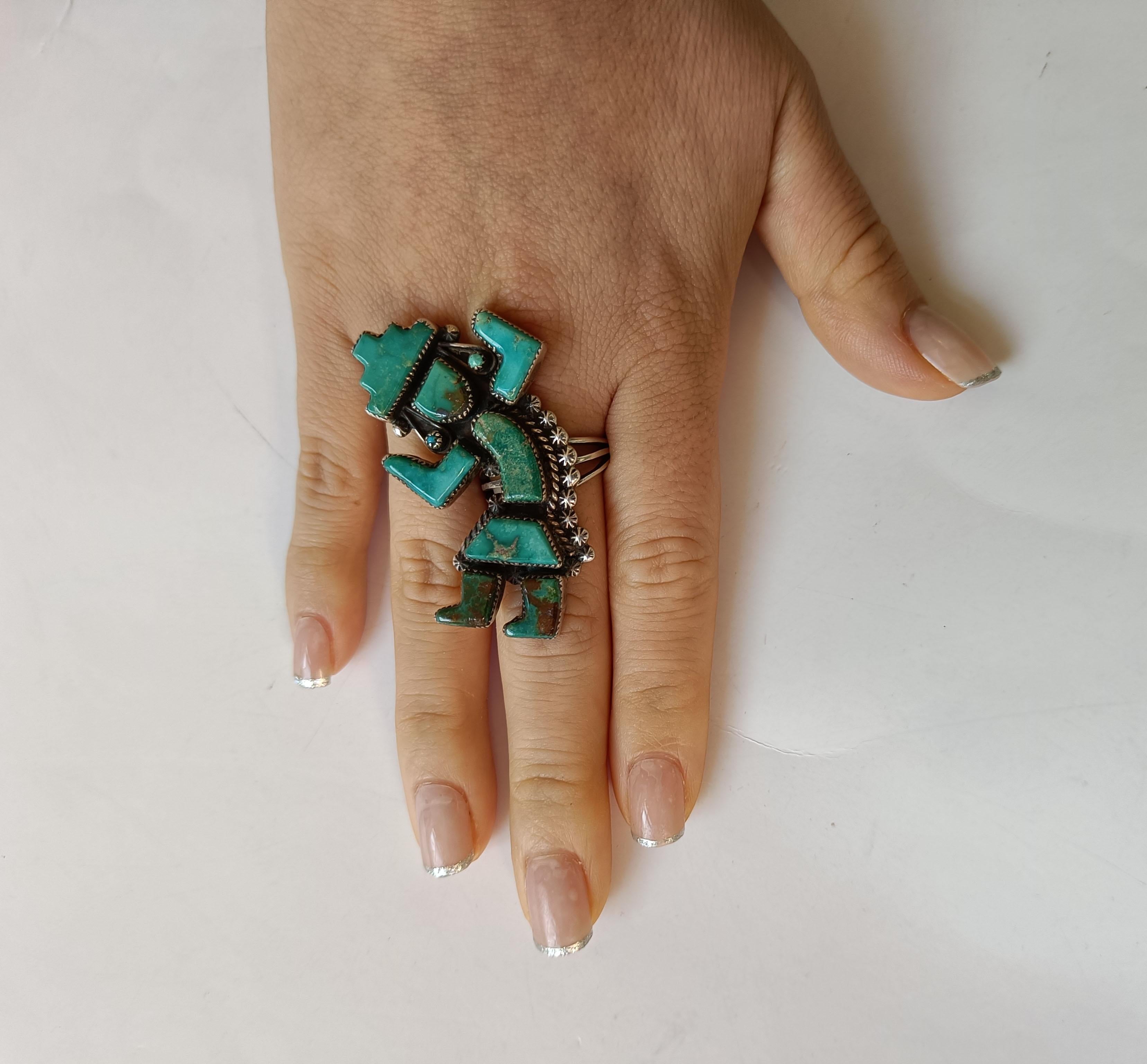 A exquisite vintage Zuni Native American silver ring with inlaid Kachina dancer  
This silver ring features a Kachina dancer inlaid with Turquoise.  
A particularly fine and  attractive Zuni ring with  turquoise cabochons  
Makers initials inside