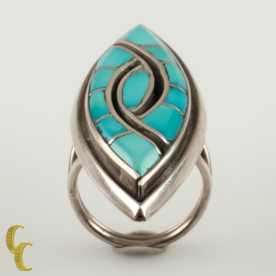 Gorgeous Native American silver ring.
Turquoise and onyx inlay.
Size: 5.25.
Length of Plaque: 53 mm.
Metal: 0.925 sterling silver.
Weight: 12.7 grams.