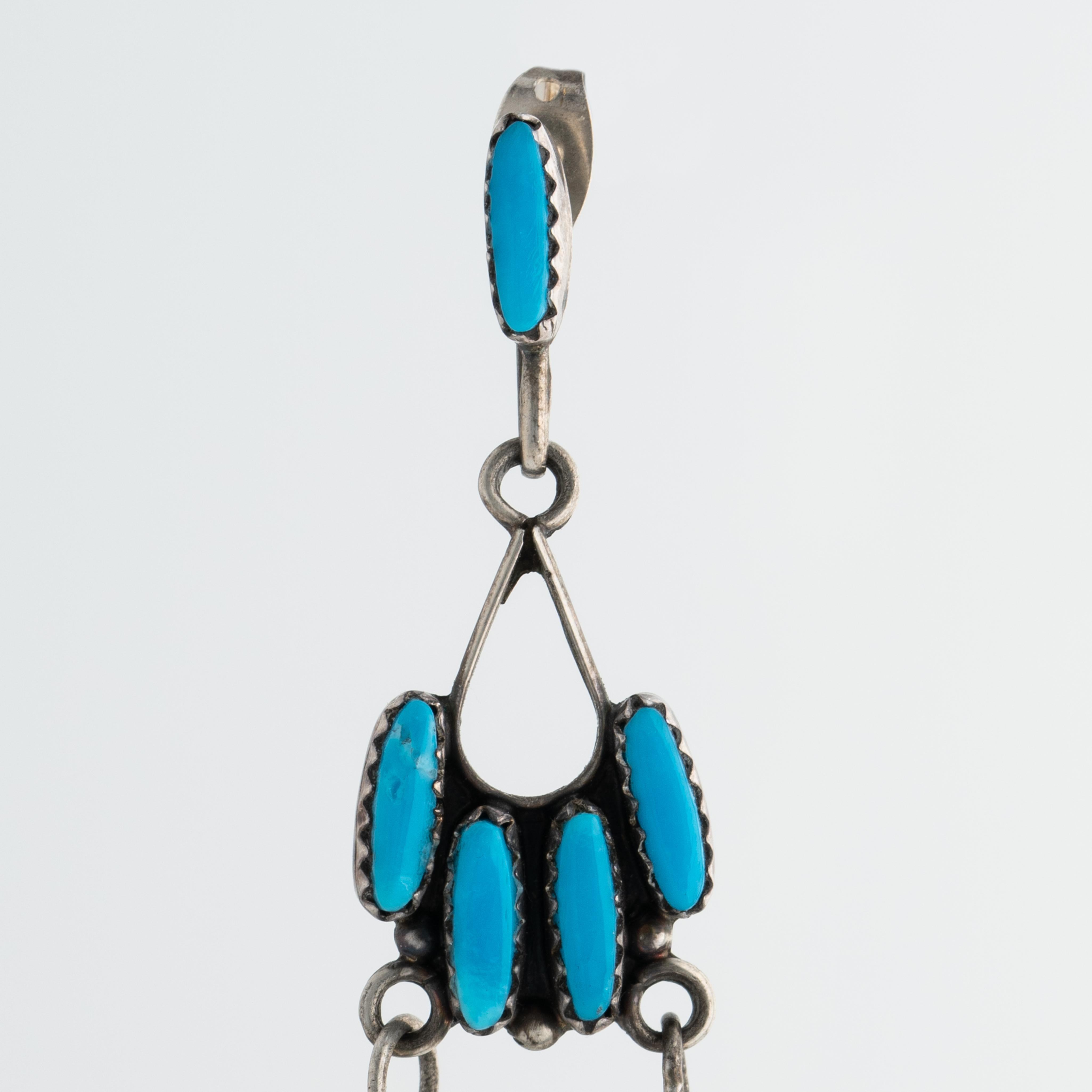 Vintage Native American Zuni Long Silver and Turquoise Chandelier Earrings c.1970s

Weight for each earring: 8.2 grams
Length: 3.34
