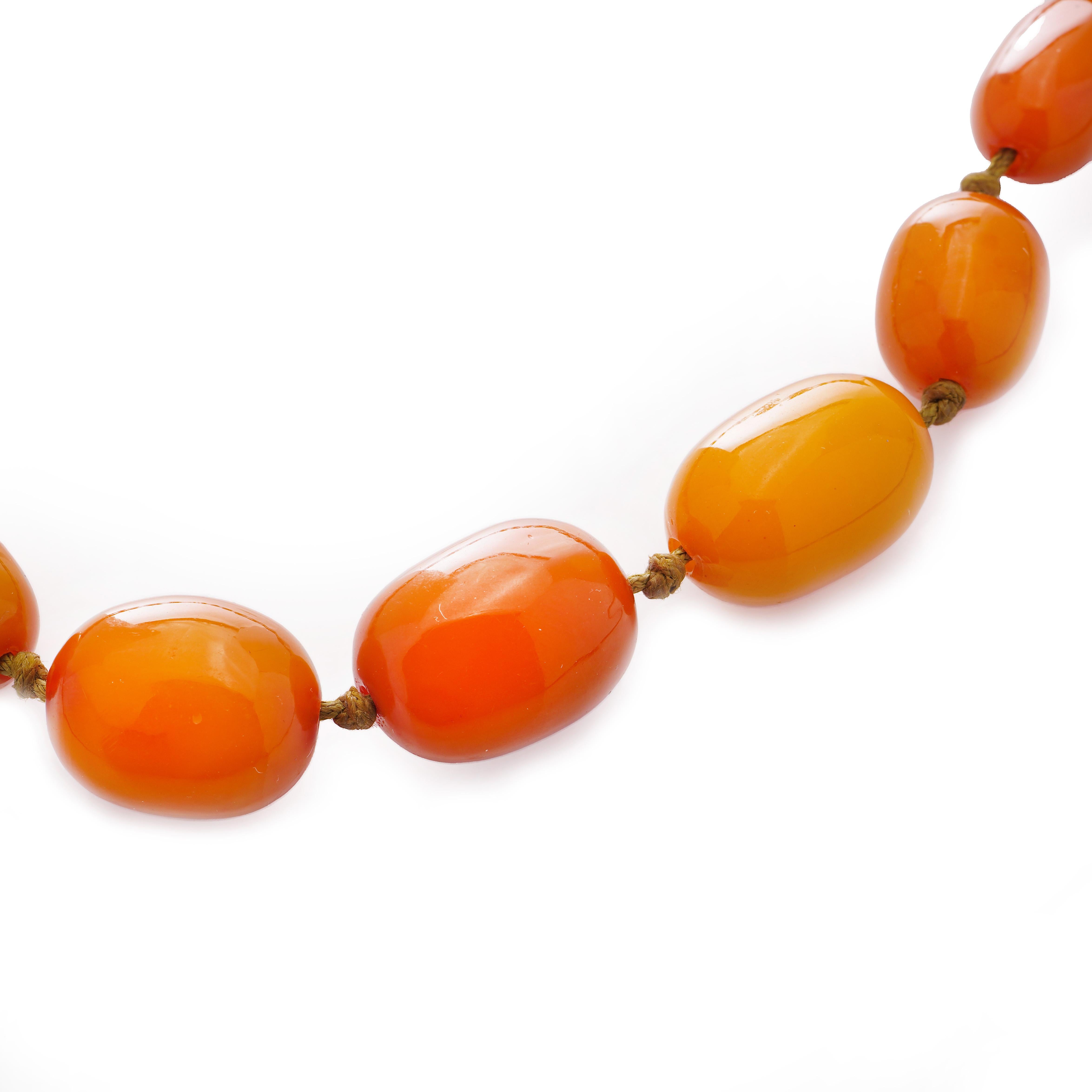 Vintage Natural Baltic Amber bead necklace.

Natural Baltic amber, sourced from Baltic states, Ca, 1950's
The necklace is made of 27 various sizes of amber beads.
The length of the necklace: 48 cm
The necklace has a gold plated clasp.
The