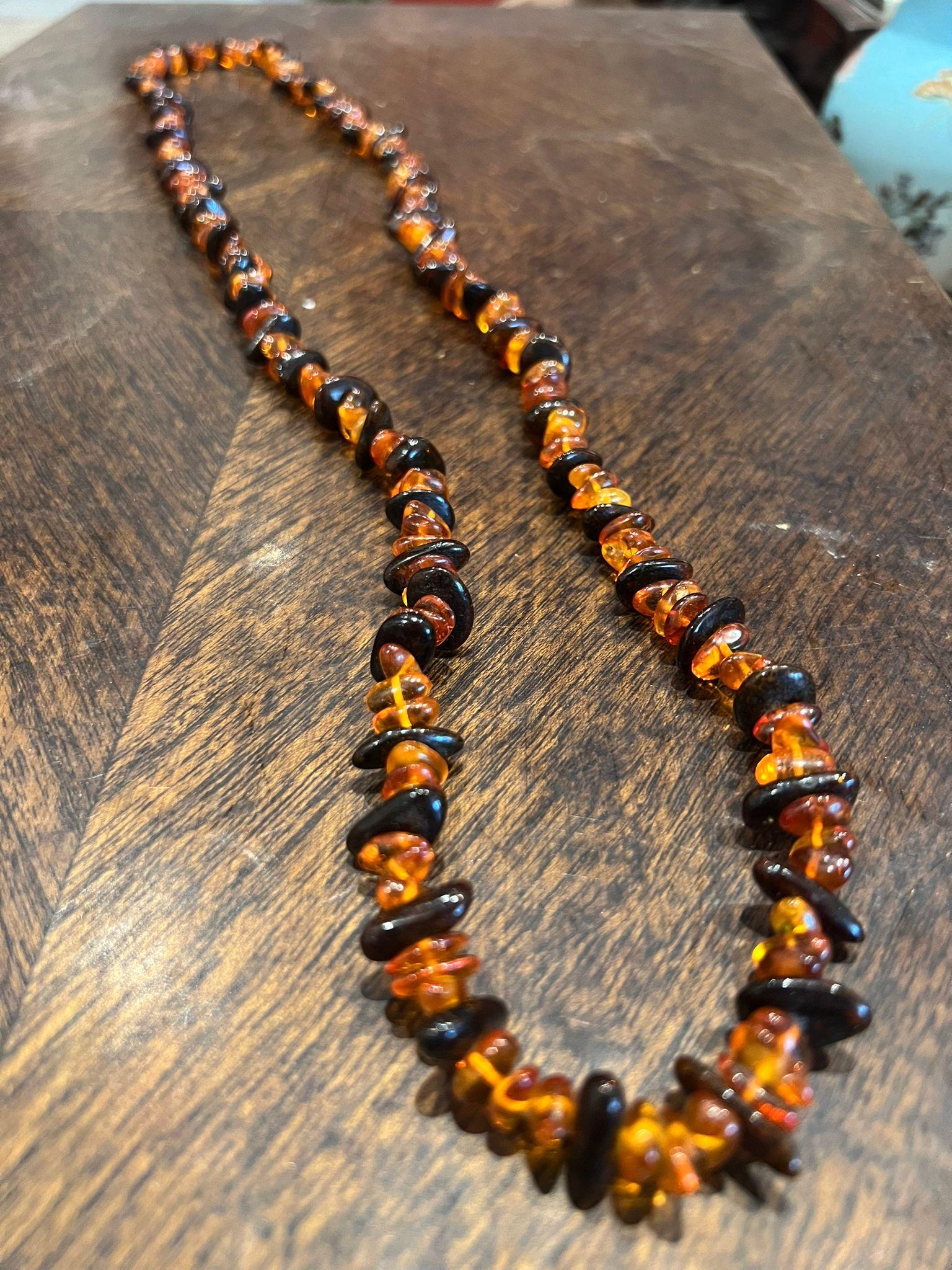 This vintage piece from Eastern Europe 
is of desirable opera length – 95cm – 37”
featuring top quality graduating Natural Amber 

Total item’s weight: 63.2gr.  

Comes in a box, accompanied by valuation certificate 