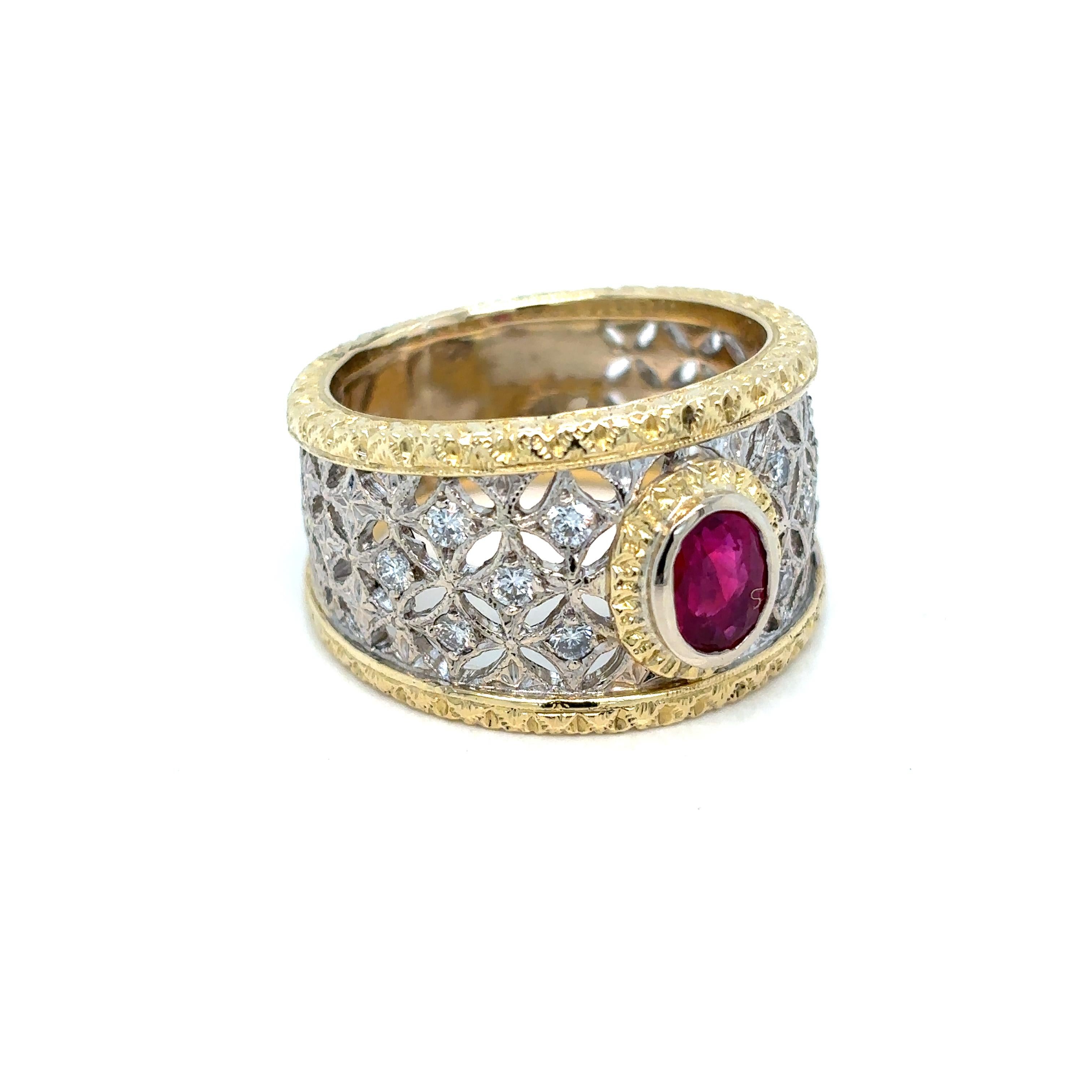 Beautiful Florentine Engraved ring, handcrafted in 18k yellow and white Gold, featuring in the center a natural Burma Ruby 0.80 carat, and surrounded by colorless round brilliant cut diamonds, 0,12 carats total. The engraved band make this ring