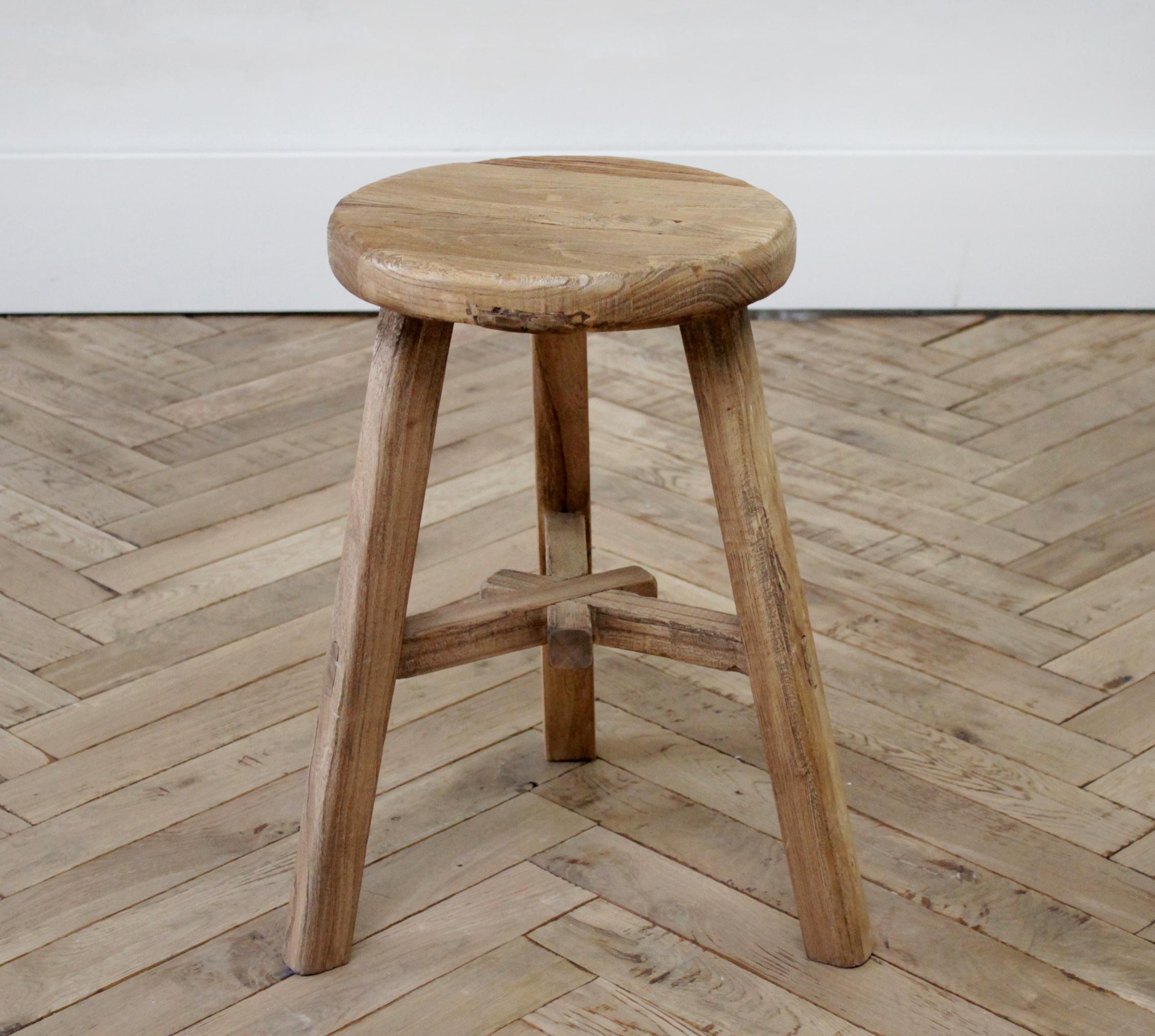 Vintage natural Chinese elm wood stool
Round seat, with tripod style legs, and unique stretchers.
Very solid and sturdy, ready for use anywhere in the house.
Measures: 11
