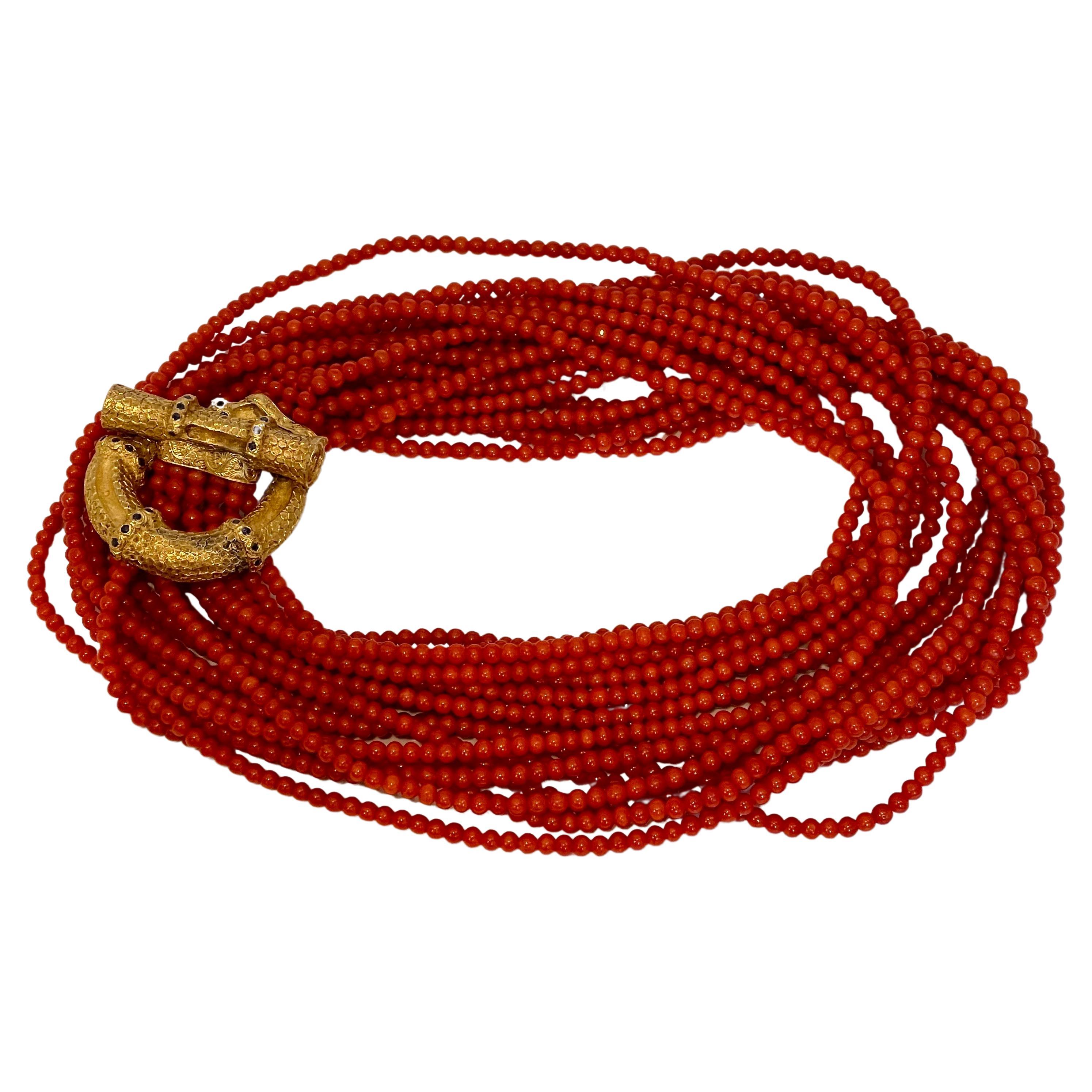 Vintage Natural Coral 4mm Multi Layer 10 Strand 920 CT Bead Necklace 18 KY Gold, 34 Inch long
A vintage piece.
There are round tiny natural sapphires on the gold clasp all over.
Very Heavy 55 grams of gold clasp of 18 Karat gold
34 inch long
10