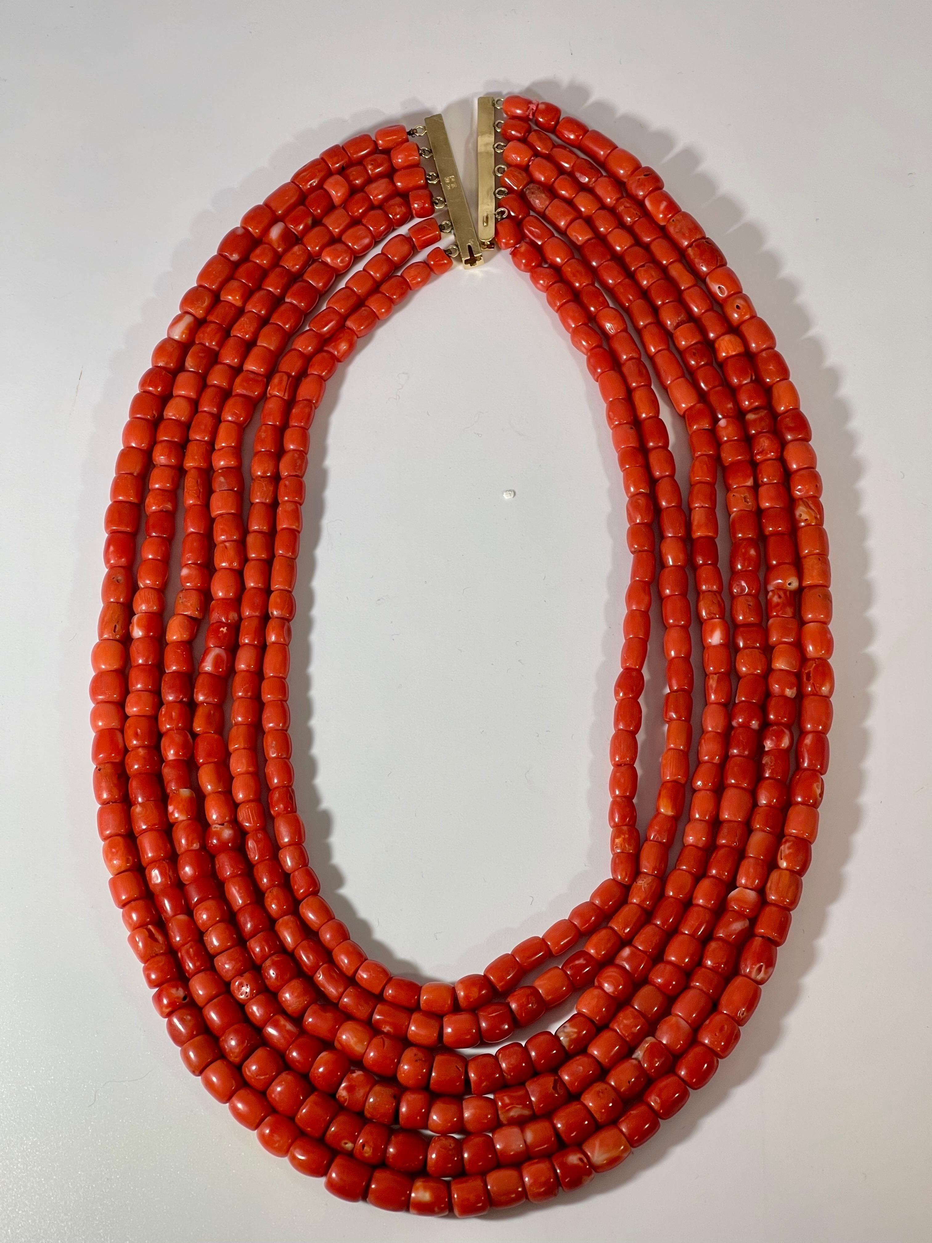 Vintage Natural Coral Multi Layer Bead Necklace 14 K Yellow  Estate.
A vintage piece.

6 layers of Natural Coral Beads
Very hard to find coral pieces now 
Gold: 14 carat Yellow  Gold 
Weight of the necklace 166  Grams
Stamped 14 K ,
Smallest layer