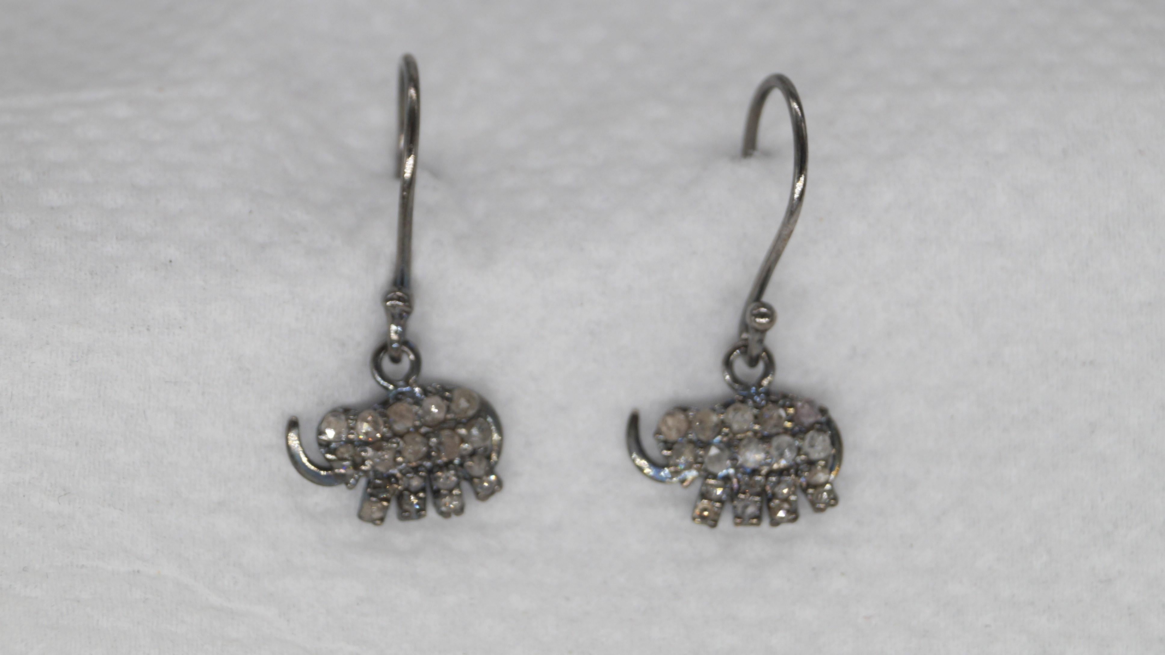 This pair of earrings have natural real diamonds. It is made up of sterling silver. It comes with a certificate of authenticity.
