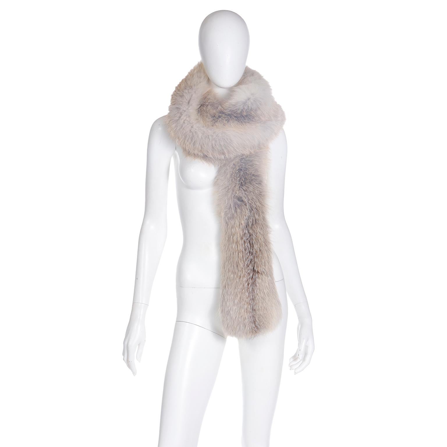 This luxurious fox fur boa style wrap is perfect for those cold Fall and Winter evenings. The fur is in soft natural shades of cream, grey and ivory and it is soft and supple. This extra long wrap can be doubled and worn around the neck or draped