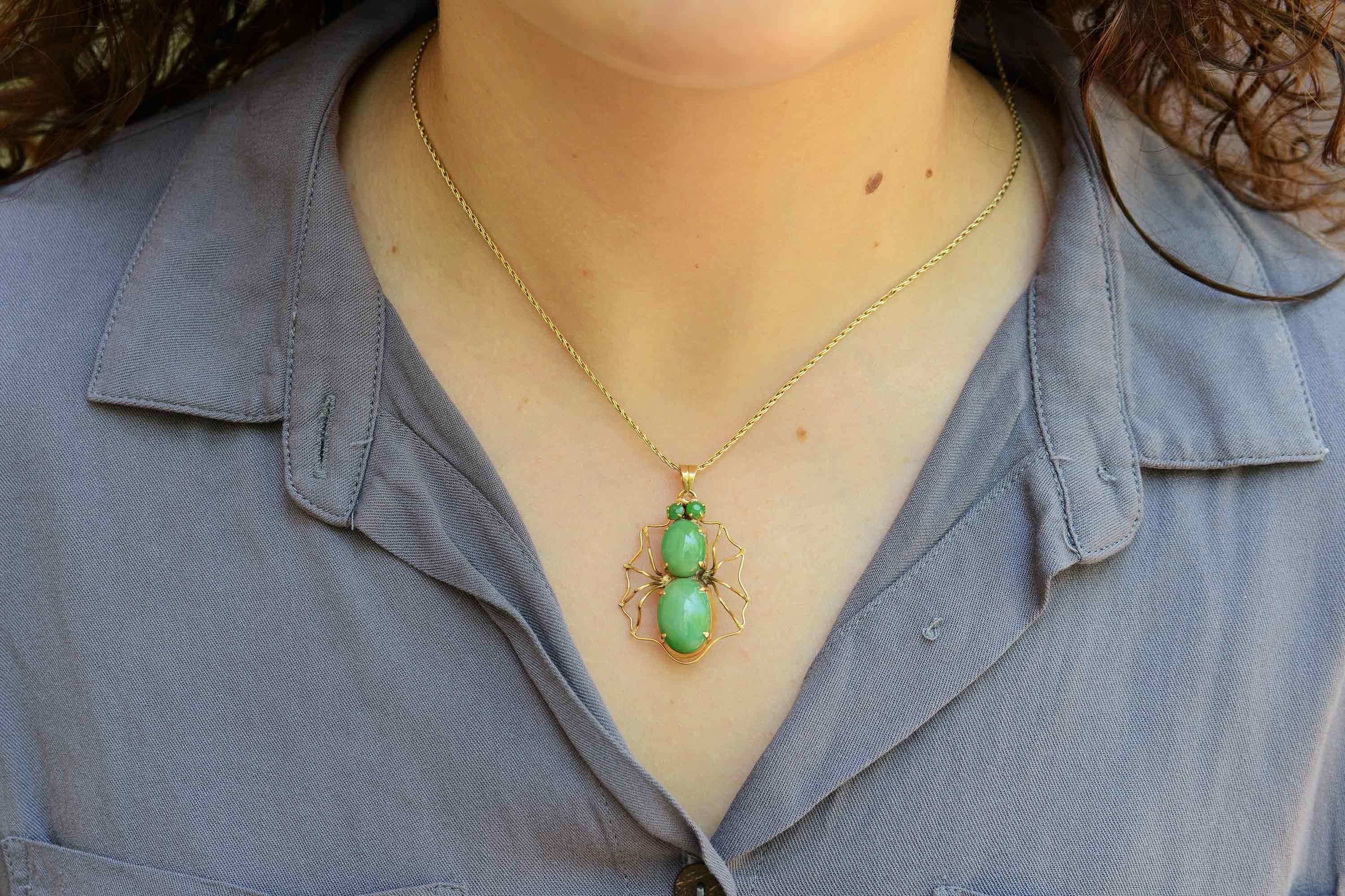 A charismatic and creepy-cool vintage natural jade spider necklace. The body set with a pair of crisp, apple-green jadeite cabochons, the clever arachnid brooch pin fashioned as a pendant makes for versatile wearability. You'll love how the frame