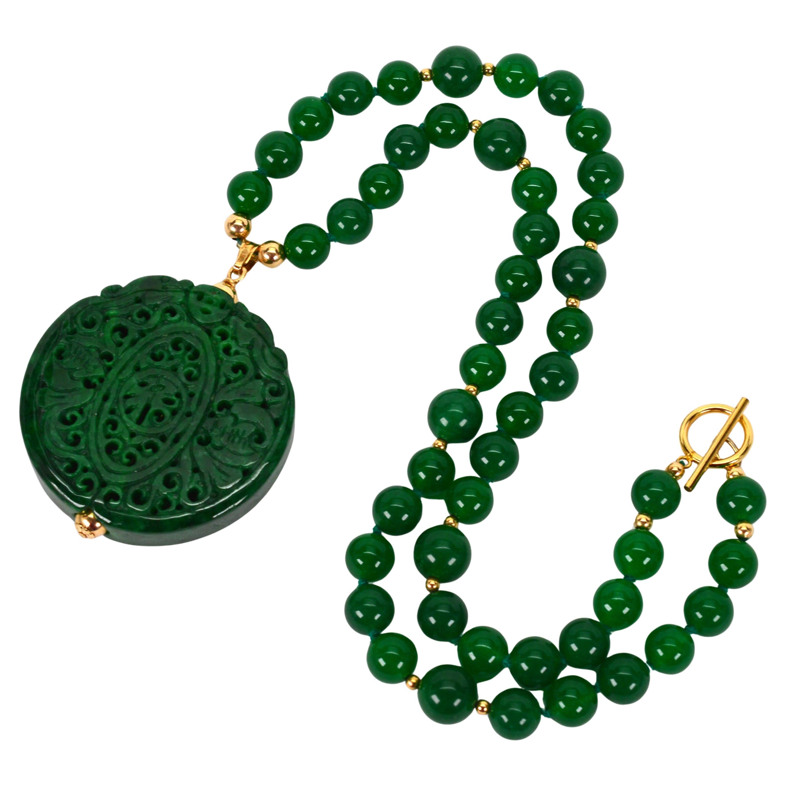 Vintage Natural Jadeite Beaded 12 Karat Necklace with Carved Medallion Pendant For Sale