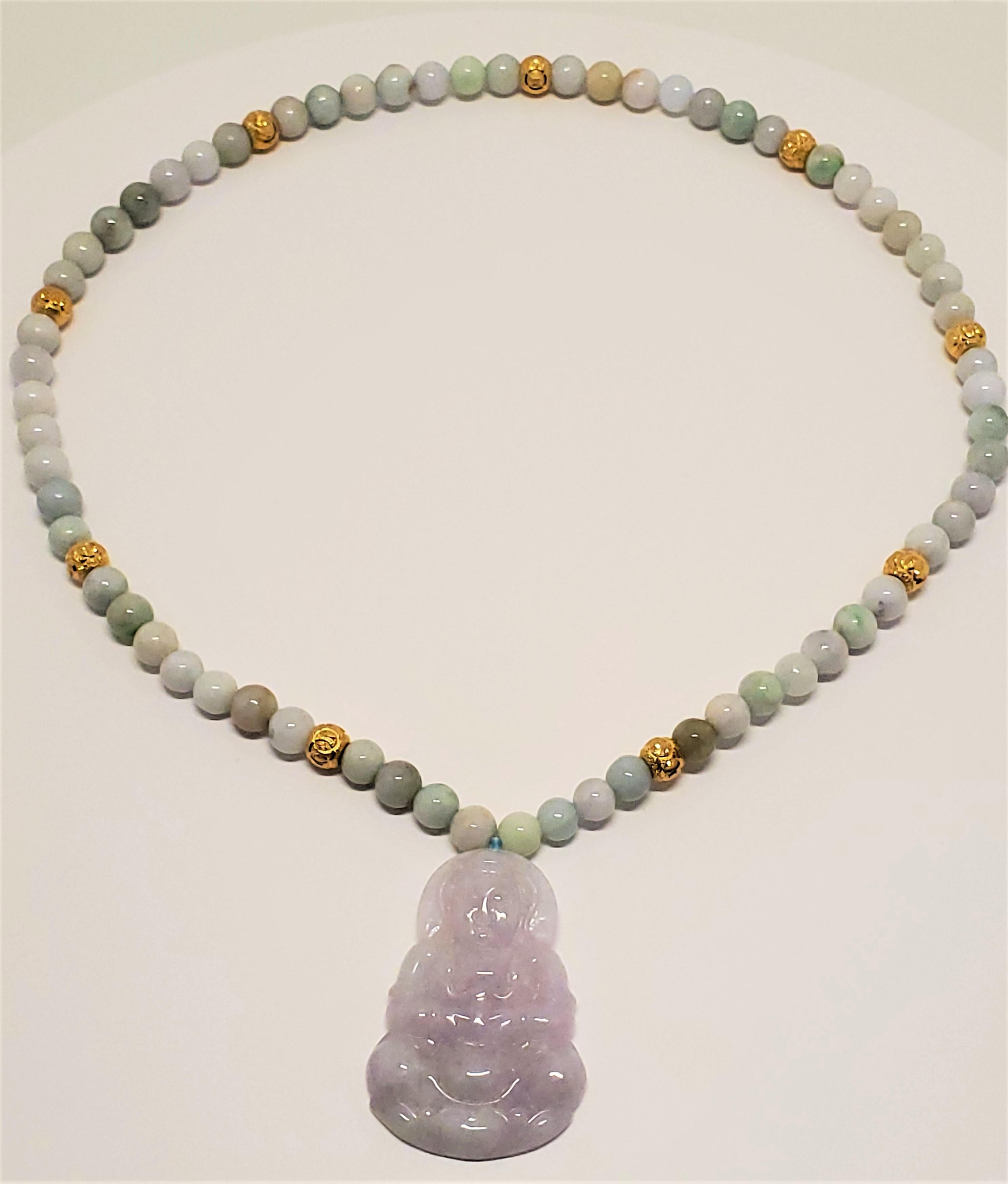 This vintage Burmese jadeite and gold beaded necklace consists of 64 round beads, 8 mm in diameter, of colours varying from white, celedon, and lavender to other pleasing pastel colours. Interspersed between the jadeite beads are 9 carvedd 24k