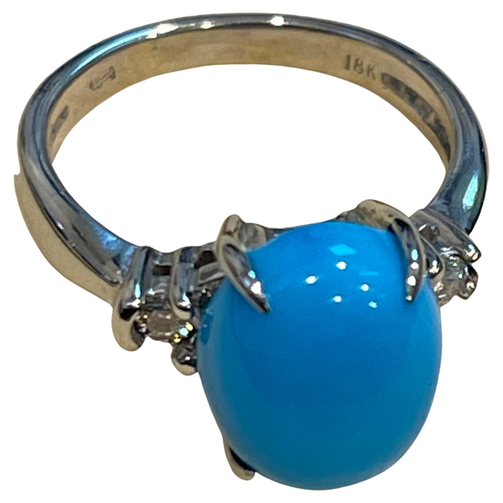 
Vintage Natural Oval Sleeping Beauty Turquoise Ring With Diamonds, 18 Karat  White Gold
Approximately 4 Ct of Sleeping Beauty  Turquoise  and  .10 Ct of Diamonds
one diamonds on each side of center stone
148 karat gold 4.5 Grams 
 Diamonds: