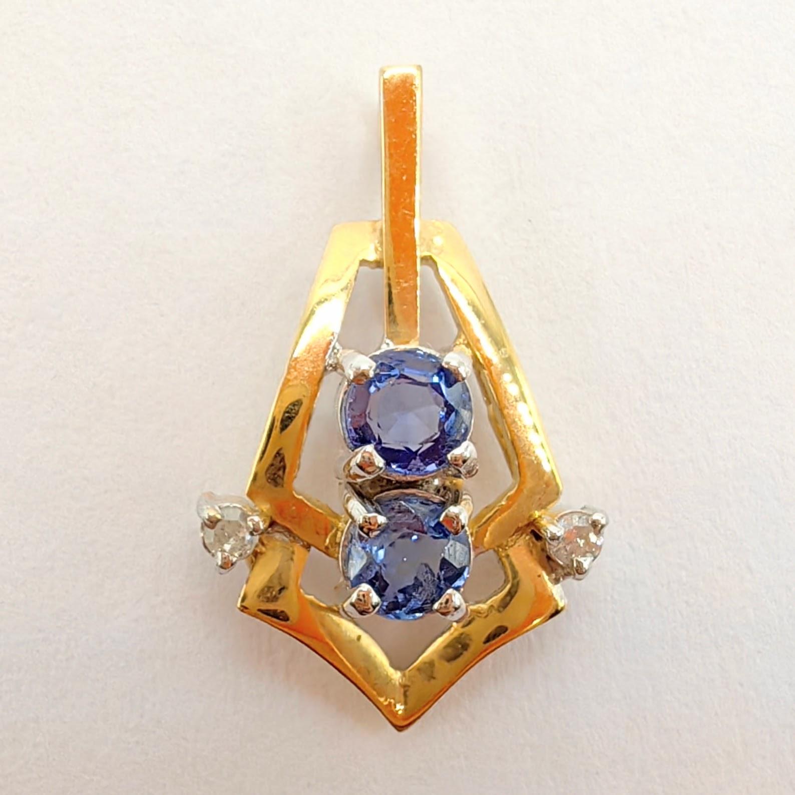 Introducing our Vintage Natural Pastel Blue Sapphire Diamond Necklace Pendant in 14K Yellow Gold, a delicate and captivating piece that combines vintage charm with the soft allure of pastel blue gemstones.

This pendant features two natural